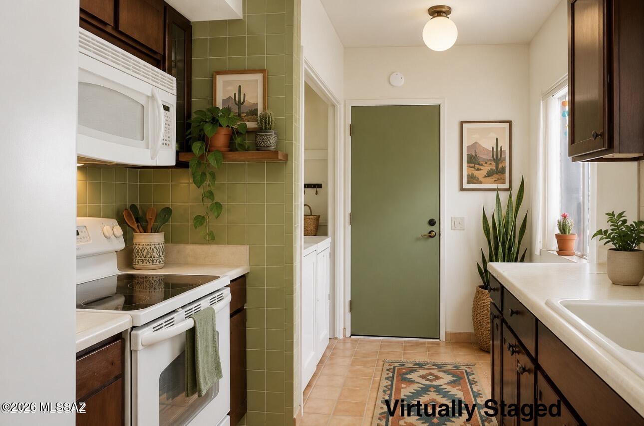 Welcome to this beautifully maintained townhome in the heart of Green Valley and part of the sought-after Green Valley Recreation community. Backing to open space with no rear neighbors, this home offers added privacy, peaceful desert surroundings, and stunning Arizona sunsets right from your backyard. Whether you're looking for a full-time residence, seasonal retreat, or the perfect place to enjoy retirement, this home delivers comfort and low-maintenance living in an active yet relaxing setting. Enjoy access to recreation centers, pools, fitness facilities, golf, social activities, and endless opportunities to embrace the Arizona lifestyle at your own pace.