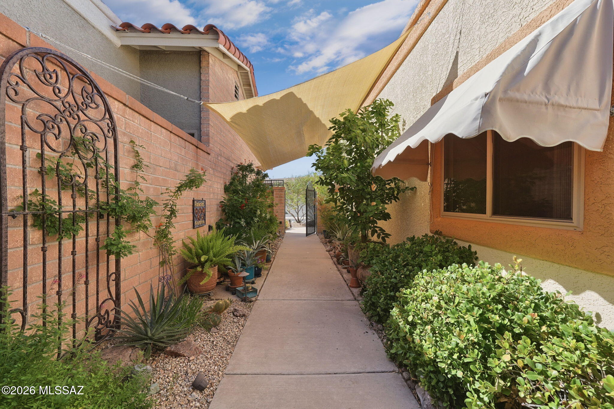FURNISHED . . . Located in the desirable 55+ community of Canoa Seca Estates, this beautifully maintained 1706 sq ft home that offers two bedrooms, two full baths and a versatile den, all nestled in a peaceful, private setting.  Designed to embrace indoor-outdoor living, this home is surrounded by mature landscaping that creates tranquil, secluded oasis. Inside, a bright, cohesive backdrop that complements any style. The thoughtfully designed kitchen showcases distinctive SAGUARO RIB CABINETRY, featuring authentic saguaro cactus skeletons elegantly framed within solid wood.  Rich texture and natural beauty, these one-of-a-kind cabinets serve as a stunning focal point while celebrating the timeless character of Southwestern craftsmanship and design. Ideally located near Green Valley Recreation Centers.  This exceptional home offers the perfect blend of comfort, privacy and convenience and community.