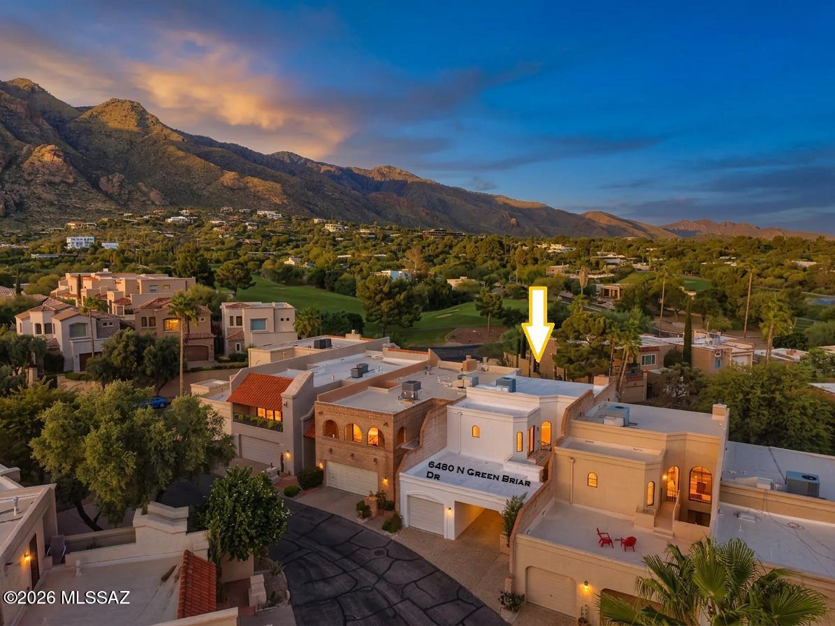 Amazing opportunity for updated 3 bed/2.5 bath, 1,818 SqFt, split floor plan, all electric masonry stucco townhome with attached 471 SqFt finished garage and carport, on low maintenance lot, omnipresent panoramic Catalina Mountain views, in the desirable gated golf community of Skyline Country Club located in the vaunted Catalina Foothills school district in North Tucson.
Experience the coveted Skyline Country Club lifestyle, where country club living meets exceptional value. An appealing opportunity for those seeking the amenities, ambiance, location and lifestyle of a premier golf community at an affordable price.
Featuring E/W orientation, aggregate concrete driveway, concrete sidewalks, additional guest parking and community pool. Inside enjoy soaring textured cathedral ceilings (no popcorn), energy efficient double pane windows throughout, matching energy efficient double pane sliding patio doors X3, custom curtains, added modern LED recessed lighting throughout, luxury ceramic plank tile flooring with plush carpet on stairs and bedrooms, convenient downstairs bedroom with slider out to covered patio and bathroom, downstairs internal laundry access w/exhaust fan, matching white GE Smart washer & dryer included, new HVAC 2023, Honeywell Pro Series digital thermostat, alarm system with Smart panel, doorbell security camera, skylights, copper and Pex plumbing, updated electrical outlets, matching modern black luminated ceiling fans, matching modern black hardware and fixtures, spacious living room features wood burning masonry fireplace and expansive picture windows create a fantastic ambiance while filling the home with abundant natural light.
Cozy remodeled kitchen with full slab quartz countertops, bar seating, crisp white modern kitchen cabinets, stainless steel appliance package, electric stove, built-in microwave, large metal sink w/garbage disposal, stainless steel side-by-side fridge w/water and ice dispenser, custom subway tile backsplash, suspended metal hanging pot rack, closet pantry, adjacent to breakfast space, conveniently located next to attached finished garage with additional storage. Ascend the sweeping carpeted spiral staircase to second story sizeable bedrooms each with their own ensuite updated full bathrooms, perfect solution for those seeking two primary bedrooms, including massive primary suite with private ensuite full bathroom complete with dual sink quartz countertop modern vanity, walk-in tiled glass shower, energy efficient double pane slider to covered balcony for daily breathtaking Catalina mountain and fresh green grass golf course views!! Enjoy tranquil Tucson nights under your covered patio space, low care backyard, surrounded by masonry block privacy walls. 
Priced below the $571,800 RVM property value report, call to make your appointment to view this updated home today!!