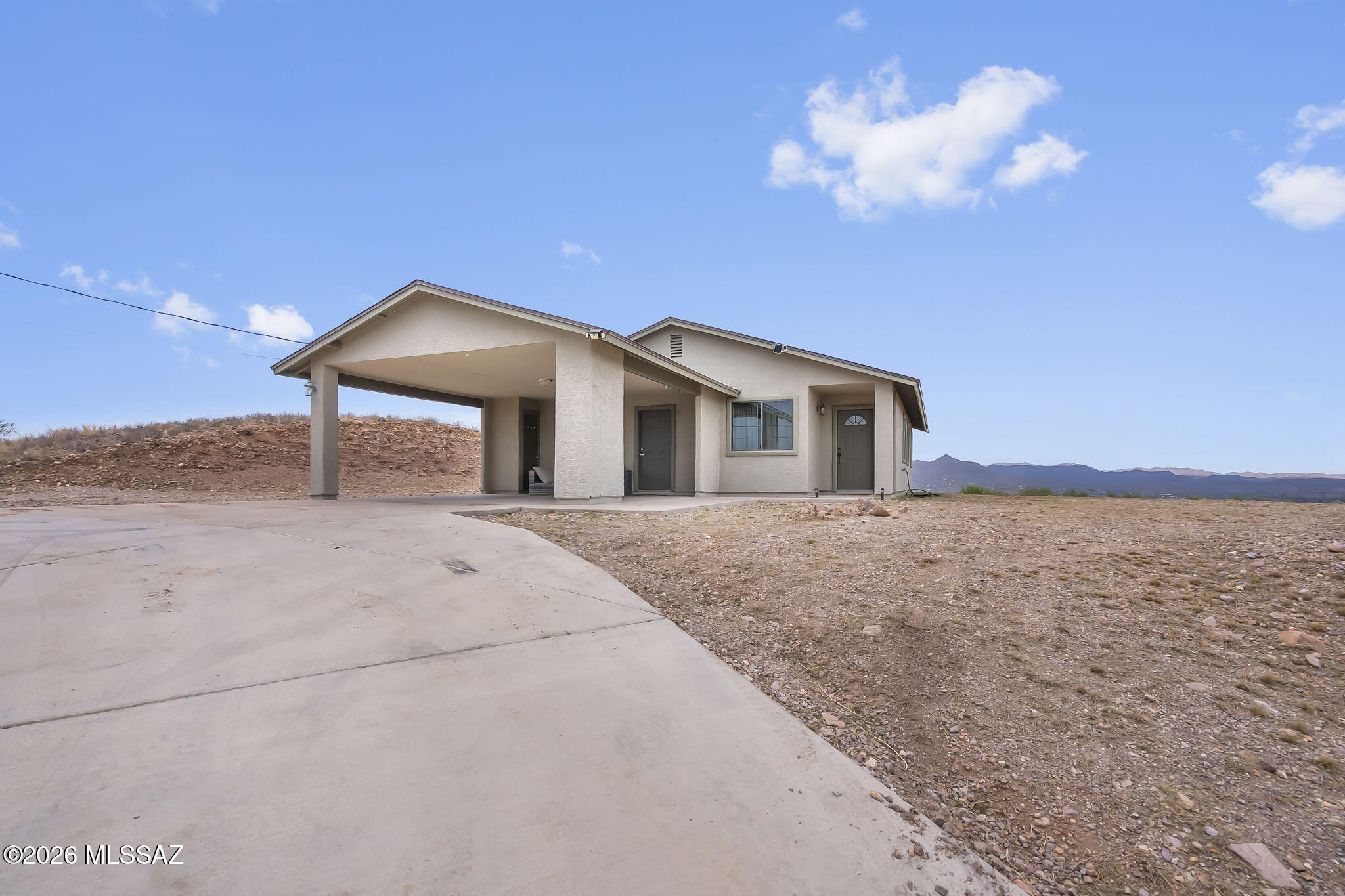 Welcome to 562 Paseo Palomino in Rio Rico, Arizona! This well-maintained 3 bedroom, 2 bathroom home is the perfect starter home, offering comfort, space, privacy, and incredible views. Inside, you'll find an open concept layout with a spacious kitchen that's great for everyday living and entertaining. The home also features a brand-new roof, giving you added peace of mind. All the bedrooms are a generous size allowing for furniture to fit with ease. Step outside and enjoy the generous lot with plenty of room to create your ideal outdoor space, whether it's for gardening, relaxing, or future improvements. Don't miss the opportunity to own this charming home in a peaceful setting.