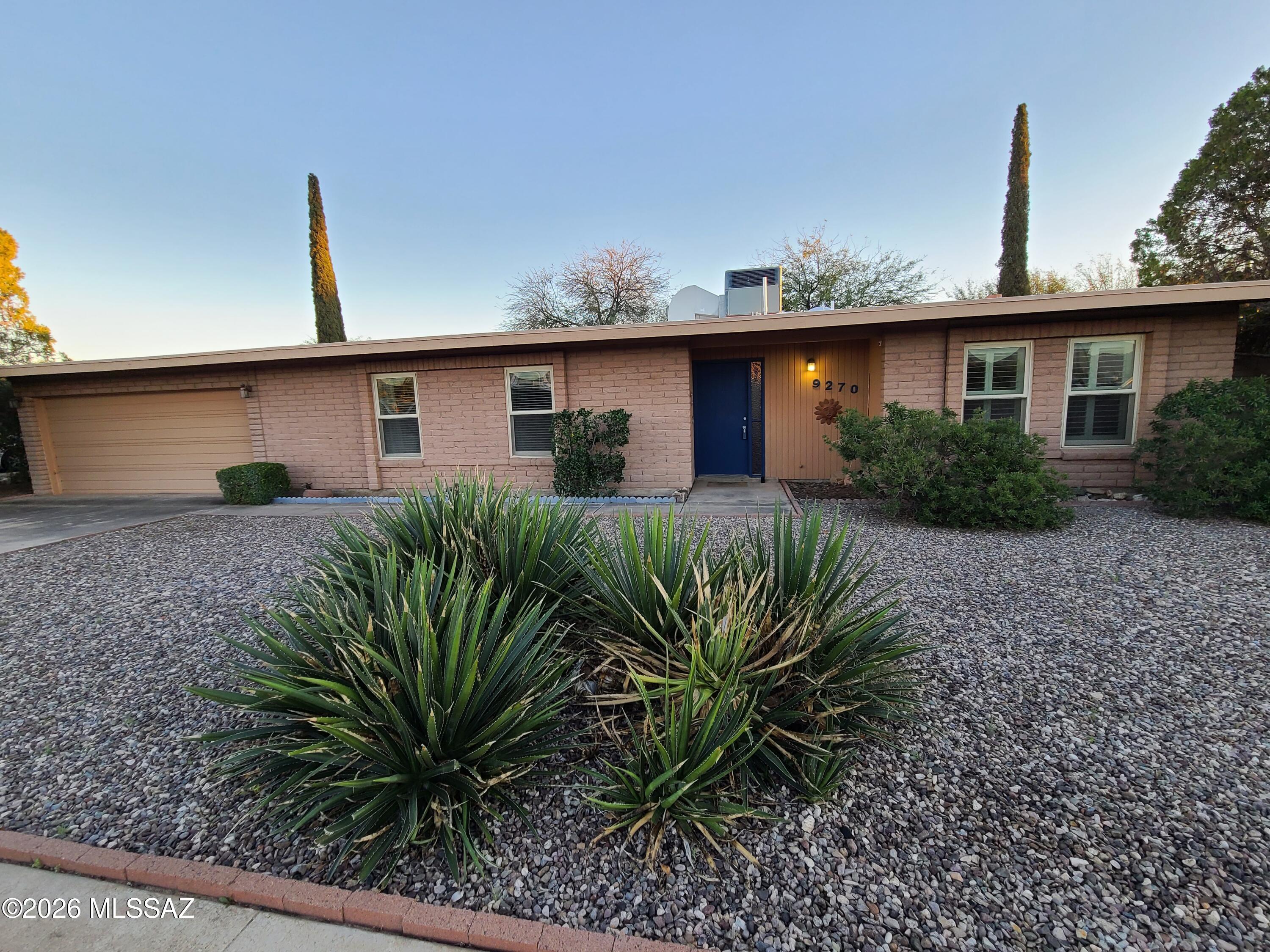Range priced from $330,000-$340,000; seller will accept or counter offers within this range. Charming 3-bedroom, 2-bath Tucson ranch with desirable split floorplan and abundant natural light. Bright kitchen with cozy breakfast nook opens to dining area with double French doors leading to an oversized backyard shaded by mature mesquite trees. Enjoy RV parking and double-gate alley access. Inviting living room with fireplace. Spacious 2-car garage includes extra storage room. Oversized lot offers endless potential for outdoor living or customization. Seller offering $2,000 flooring credit at close of escrow--make it yours today!