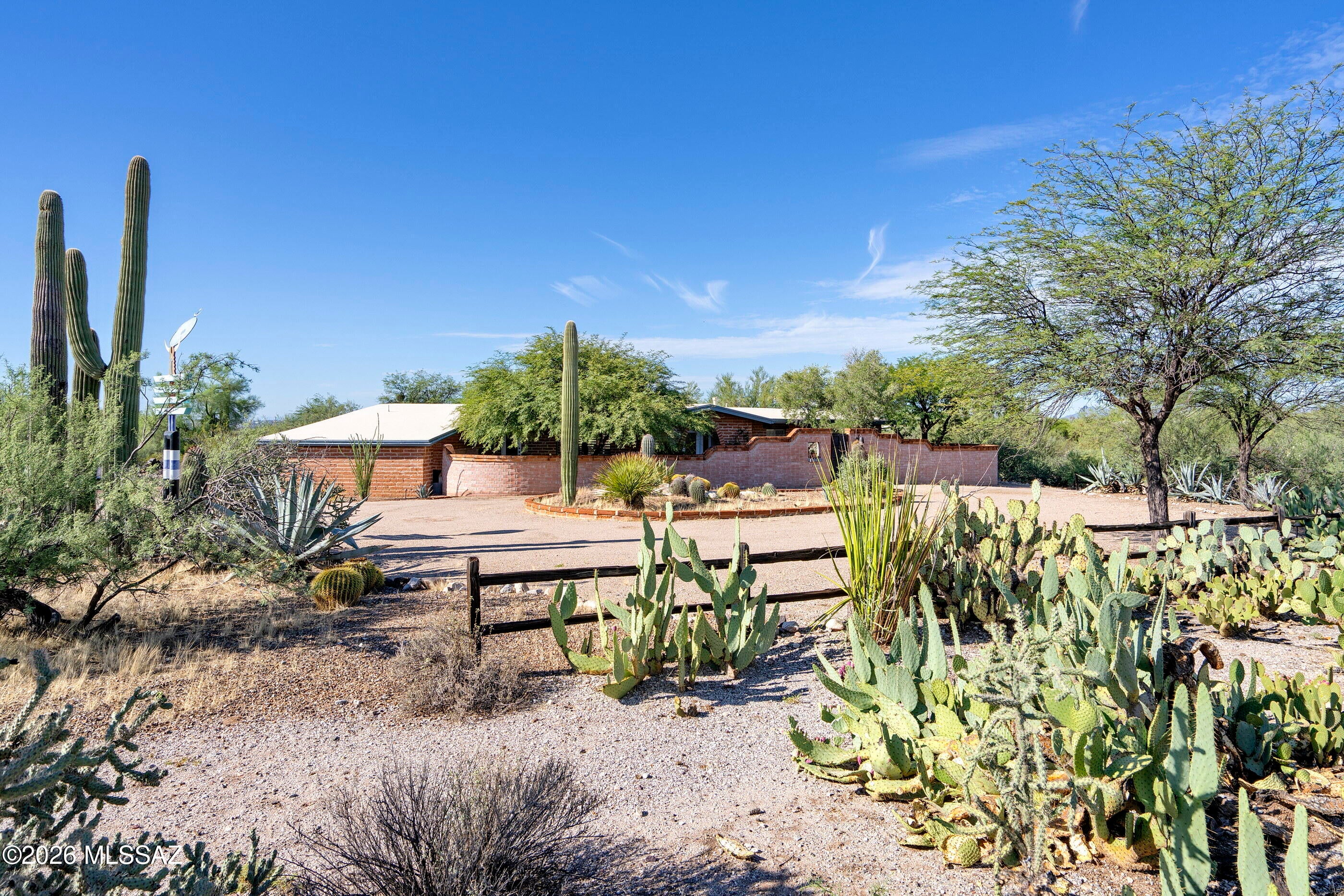 Tucked away on 2.66 acres, this private 3 -bedroom, 2-bath burnt adobe home captures the character of the Tucson Foothills. NEWER HVAC/2025. New water line replaced. Pool renovated!  A meandering drive leads to warm, inviting spaces where textured walls and a naturally aged patina complement the desert setting. Double French doors open to a private veranda & south-facing courtyard overlooking the pool. A large fireplace graces the great room.  The charming kitchen has an abundance of cabinets, sit down bar, and connected family room.  Wander the pathways through lush native vegetation and enjoy the beauty of the surrounding desert from every angle. Inquire with the agent about furnishings available through a separate bill of sale.  You don't want to miss out on this one! Stunning !