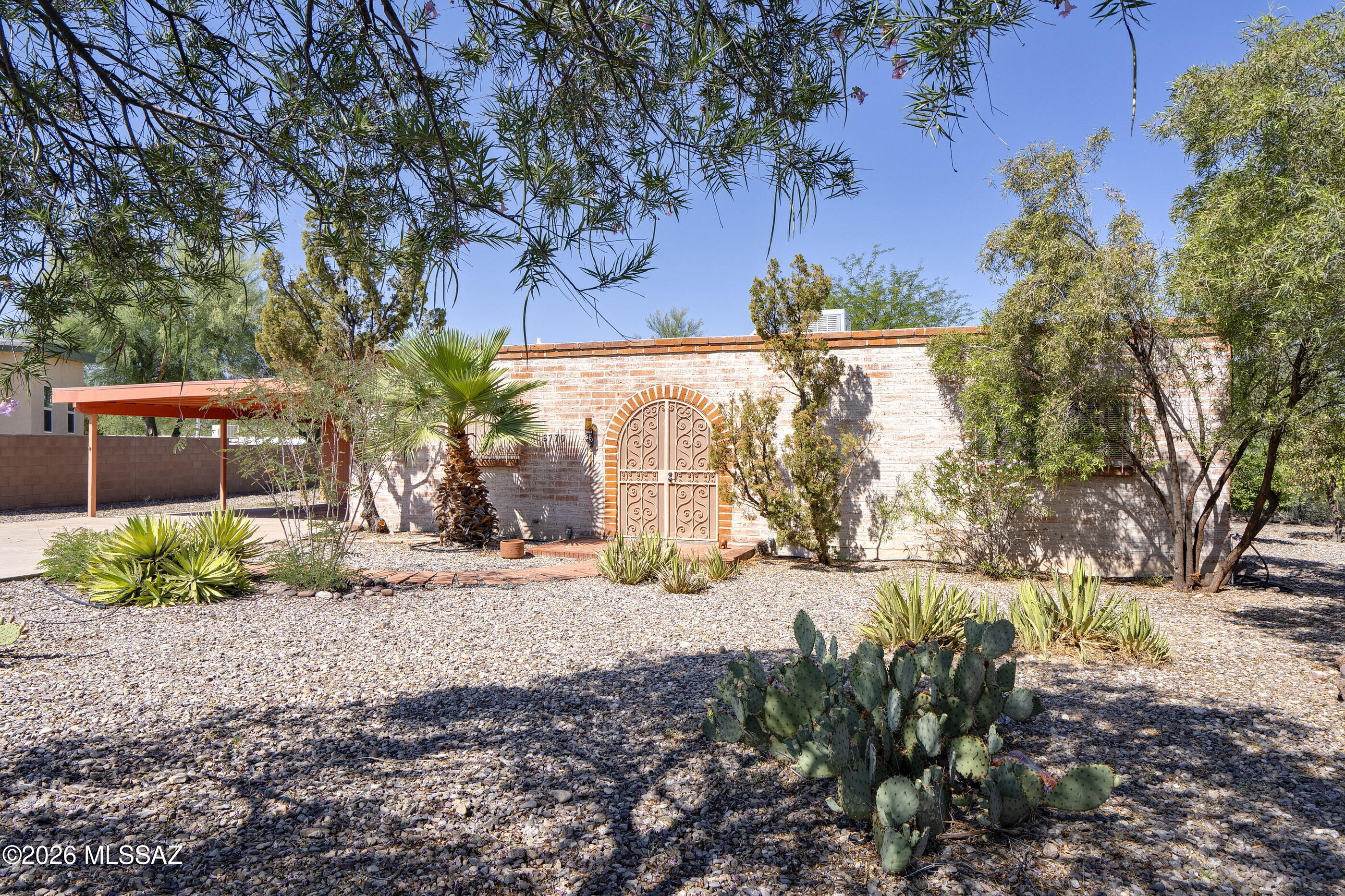 Nestled at the end of a cul-de-sac street, this mid-century adobe home is ready for its next
owner. Located on almost a third of an acre with a private backyard and extended covered patio is a great place to relax after a long day. This 2-bedroom 2 bath home has a large great room with a fireplace for the winter nights. Large storage room off the carport could be used as a workshop. Dual sinks and walk in closet In the primary bedroom and bath are great additions for the next owner.