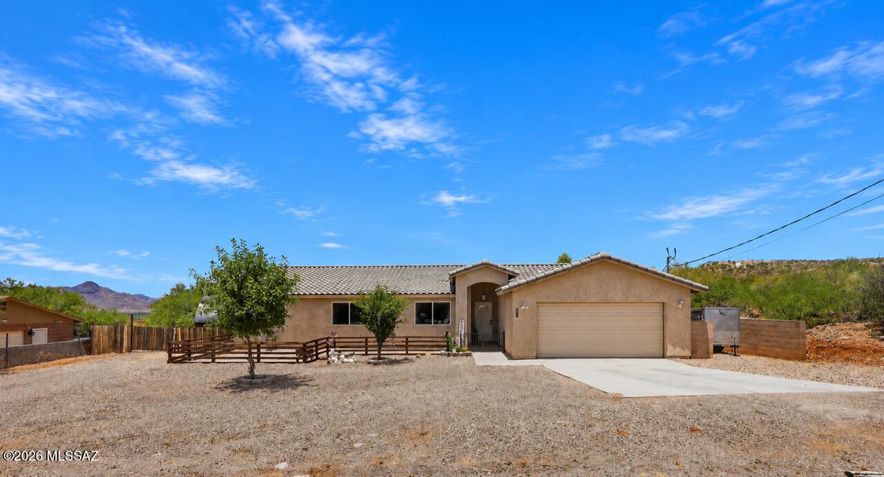Welcome to your private Arizona retreat! Situated on 1.07 Acres. 4 bedrooms with oversized master ensuite and walk in closet as large as another room. Designed with entertaining in mind, this backyard oasis features a spa, outdoor barbecue area, artificial turf, mature landscaping with fruit trees, garden planters, green house. RV parking. Animal lovers and hobby farmers will appreciate the space for a small farm, chickens and other agricultural pursuits. Inside the comfort living continues with floor to ceiling brick electric fireplace surround. Modern kitchen with LG appliances. This one-of-a-kind property has Solar that will be paid off at closing and will save you hundreds on electric. Enjoy sitting on the porch swing watching the sunsets with a peaceful surrounding.
Owner/Agent
