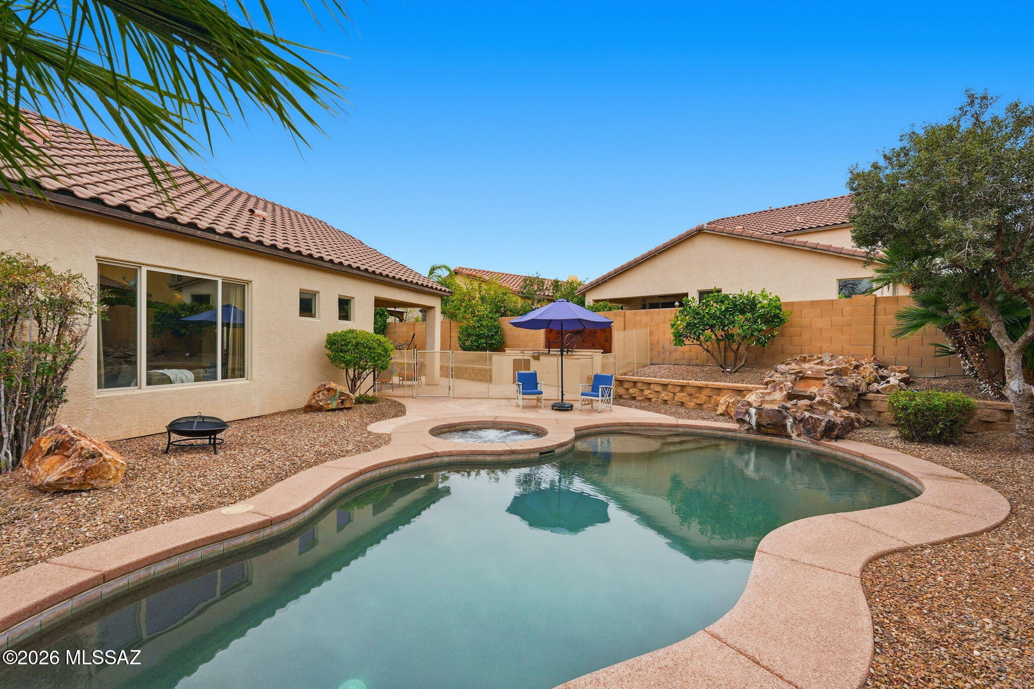Sellers will assist with up to $10,000 toward Closing Costs or Interest rate buydown with approved offer. This beautiful home is nestled towards the end of the cul-de-sac & located minutes from A+ rated Innovation Academy school. Step inside and you are immediately greeted with an open, bright & inviting space. A lovely floor plan allows for comfort & privacy while also creating connection. Featuring 3 bed/2 bath & a large office/den, this home is a perfect size to fit many different needs. The eat in kitchen with breakfast bar is a wonderful space to gather while the outdoor area includes a sparkling pool, Jacuzzi, & serene waterfall along with lush turf & a gas barbecue making it a tranquil retreat year round.