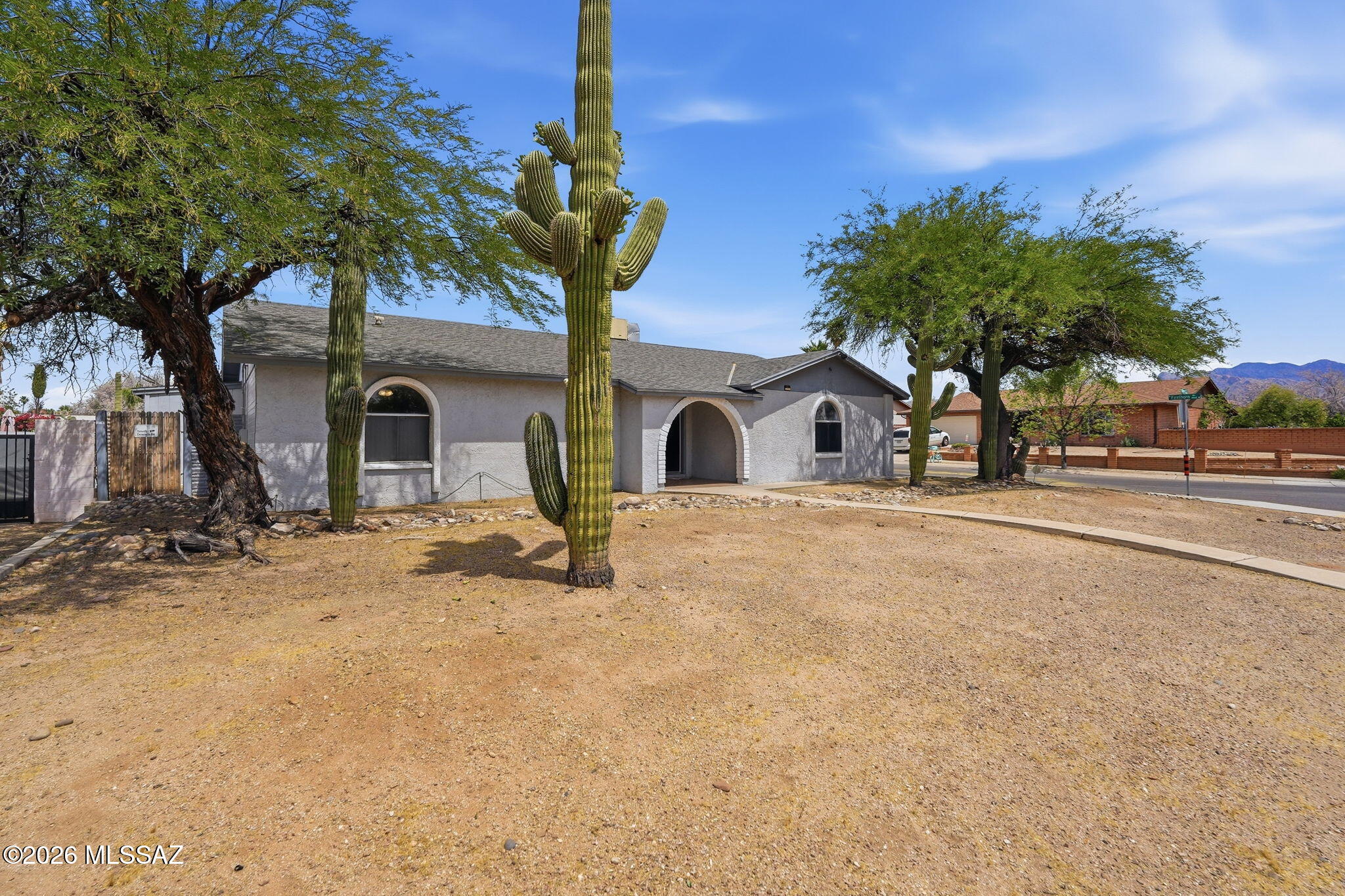 Charming 5-bedroom, 2-bathroom home on a large corner lot in NW Tucson. Classic slump block construction, open lay out with nice natural light and cozy wood-burning fireplace, creating undeniable charm with added character. Split floorplan with two rooms on one side and three on the other. Primary bedroom features ensuite walk-in shower and his/her closets.
New kitchen cabinets and countertops, laundry room just off of kitchen, screened AZ Room for added space, large backyard with double metal gates for RV parking.
Conveniently located just minutes from I-10 and major shopping centers, this home perfectly balances peaceful neighborhood living with everyday accessibility.