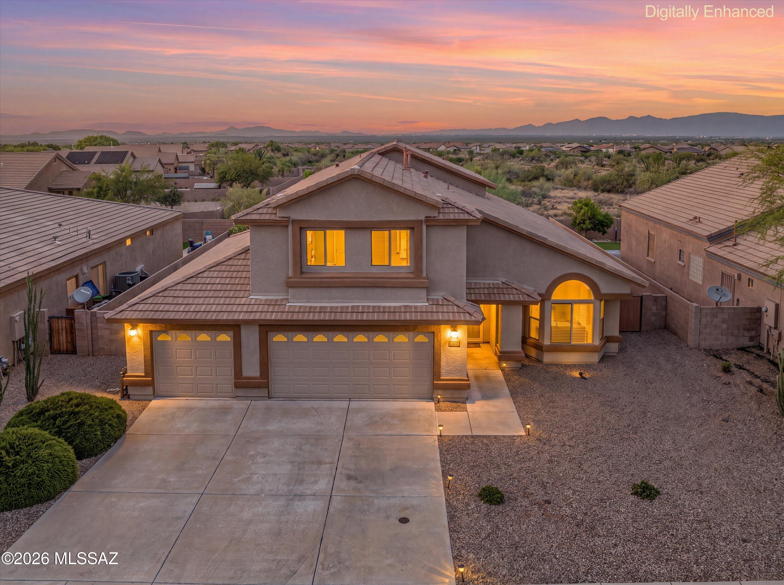 Welcome to this beautifully maintained 5-bedroom, 3-bathroom home, ideally situated at the end of a quiet street with no rear neighbors, bordering open common area for added privacy. Enjoy a desirable north-facing backyard with breathtaking mountain views, creating the perfect setting to relax or entertain.
Designed with both comfort and flexibility in mind, the spacious floor plan features a generously sized downstairs bedroom and adjacent full bathroom - ideal for guests, multi-generational living, or as a home gym, media room, office, playroom, or flex space to suit your lifestyle.
The entire exterior has been freshly painted, enhancing the home's curb appeal and providing peace of mind for years to come. Step outside to a beautifully maintained backyard featuring fruit trees and vibrant rose bushes, offering a serene outdoor retreat with plenty of space to enjoy Arizona's beautiful skies.
Located within the Vail School District, this move-in-ready home offers the perfect combination of peaceful surroundings, flexible living spaces, and everyday convenience. Pride of ownership is evident throughout, making this an exceptional opportunity you won't want to miss.