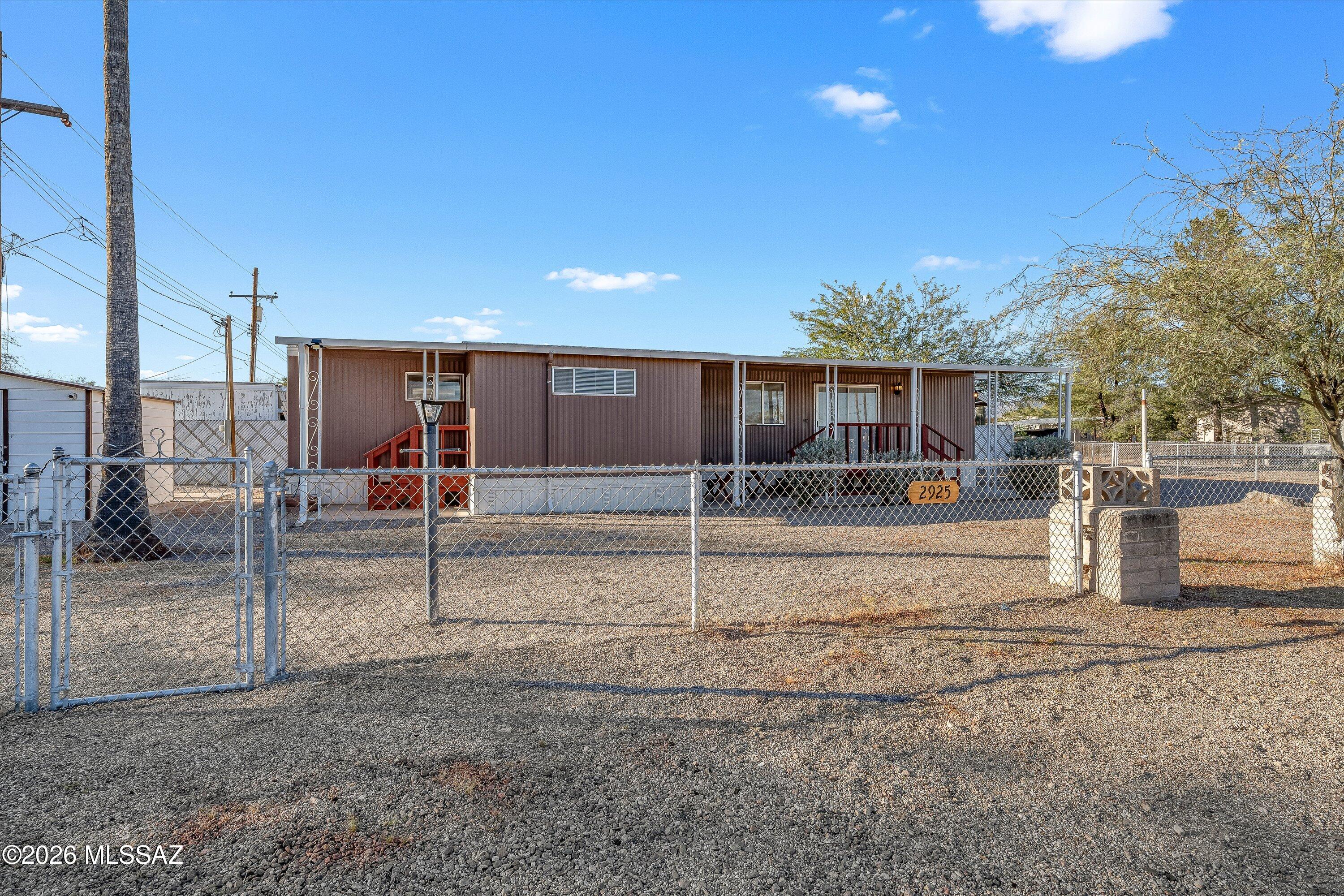 Affordable opportunity in a quiet, established neighborhood! This 1BD/1BA affixed 1968 manufactured home has been refreshed with updated flooring and interior finishes, creating a bright and comfortable living space. Functional kitchen with ample cabinetry opens to flexible living area. Recently replaced AC system provides year-round comfort. Property includes covered outdoor areas, fenced yard space, and off-street parking. Ideal for a starter home, winter retreat, or investment property. Seller may consider owner financing with acceptable terms. offering added flexibility for qualified buyers. Owner is a licensed Arizona Real Estate Broker.
