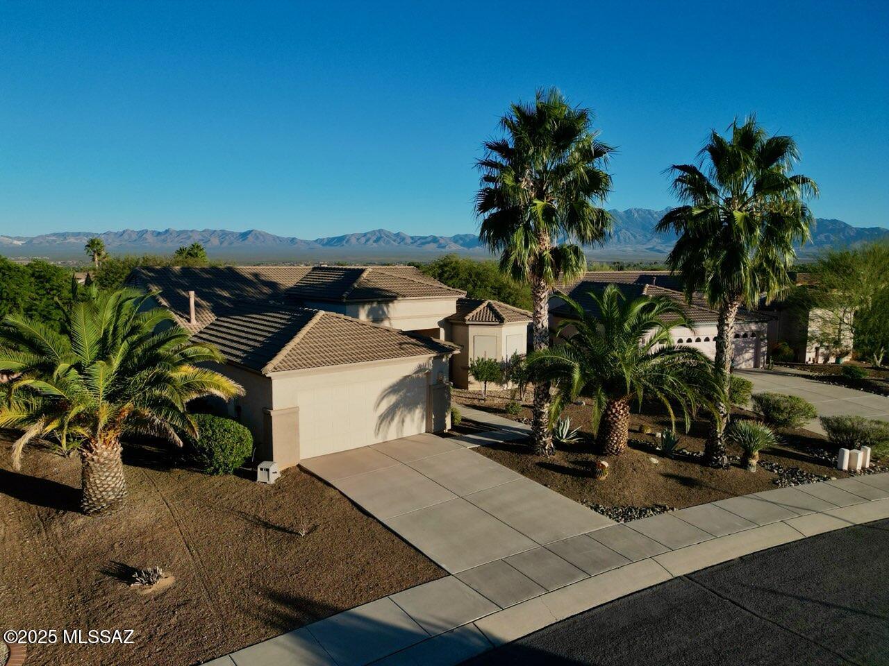 Seller offering $16,000 flooring allowance with the option of buyer selecting flooring colors and installation to be completed prior to close of escrow. Ask about details! Welcome home to this inviting 2-bedroom, 2-bath + den home perfectly situated on a quiet street. With its open-concept layout and new kitchen counters, this home combines modern comfort with easy living--ideal for relaxing or entertaining.  The entire interior has been freshly painted making the entire space feel fresh. Enjoy the large, private yard with beautiful mountain views. The spacious den offers flexibility for a home office, craft room, or guest space.  The large laundry can double as additional office or storage. For you big-truck owners--the garage is extended depth.