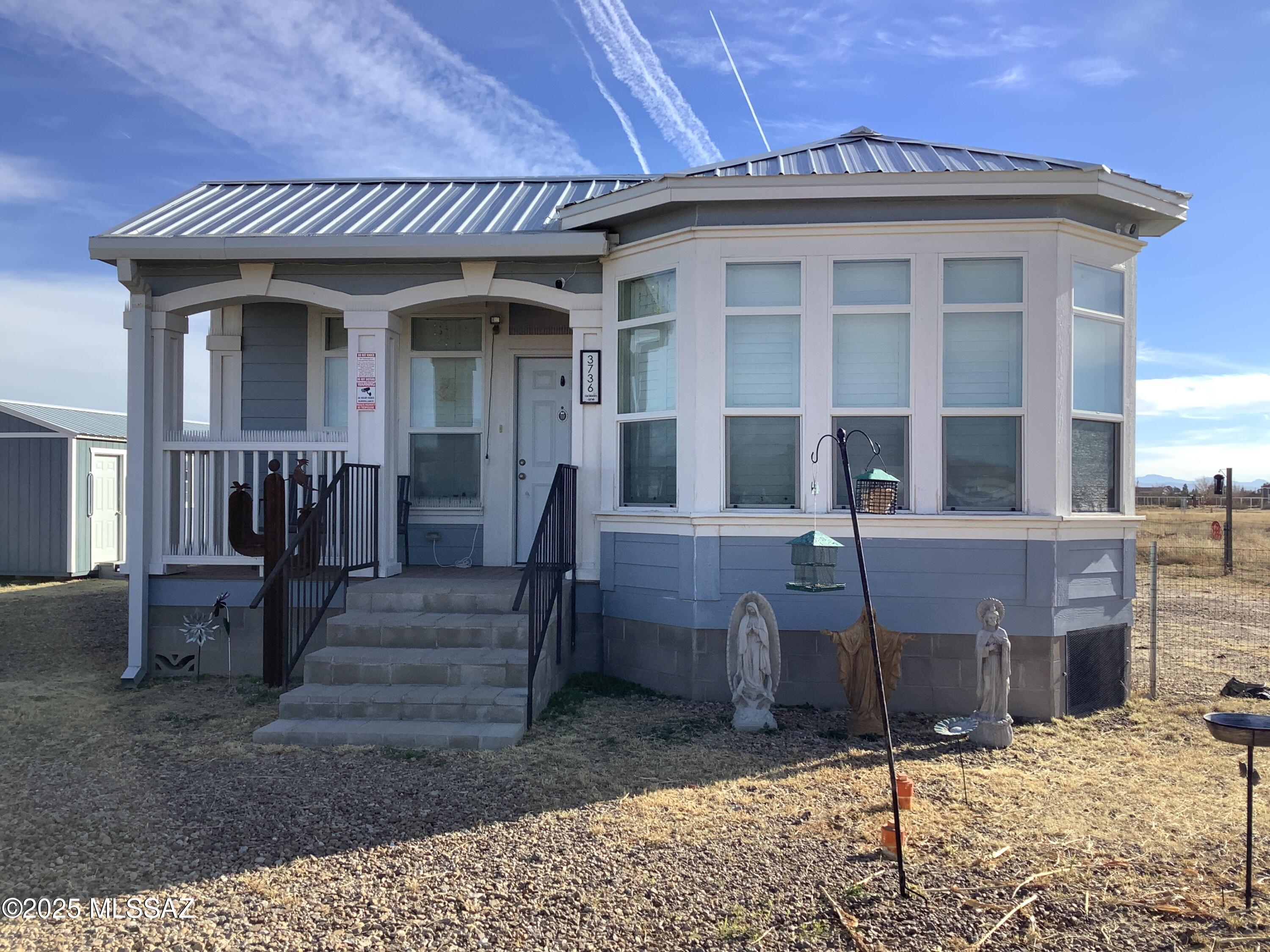Talk about location, close to town just off paved road, not far from interstate if you need to commute. Fantastic mountain views that capture sunrises and sunsets.  Well maintain and upgraded new metal roof in 2024, new plantation shutters on all window, ceiling fans in all rooms, large shed with electric being used as a gym. Outside there is plenty of room to roam, nice play-set, Fenced in side yard. This is a must-see house.
