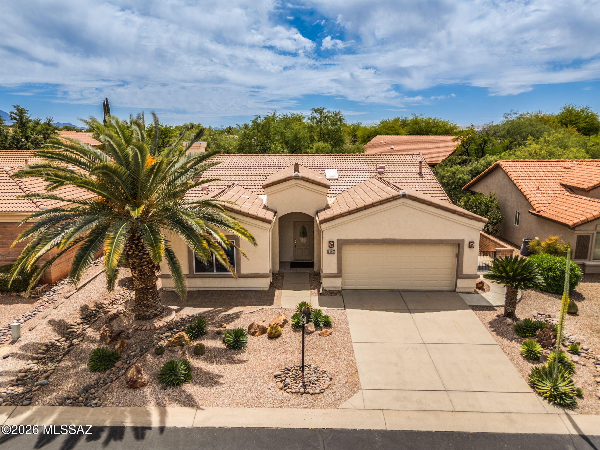 NOT TO BE MISSED!  Step into comfort and charm in this 2-bedroom, 2-bath home w/Fireplace offering 1,816 square feet of inviting living space. Designed for both relaxation and functionality, this home also features an Arizona Room-perfect for enjoying year-round sunshine. Recent upgrades provide peace of mind, including a New Roof and HVAC system installed in 2021, along with newer kitchen appliances that make cooking and hosting a breeze. A whole-house water filtration system adds an extra touch of quality to everyday living. All NEW CARPET installed 5/11/26.  Pick your own colors with a NEW PAINT CREDIT to buyer at closing. The Backyard has ample space for gardening. Mature citrus trees--including Tangerine, Meyer Lemon, and Lime--offer fresh, homegrown treats.