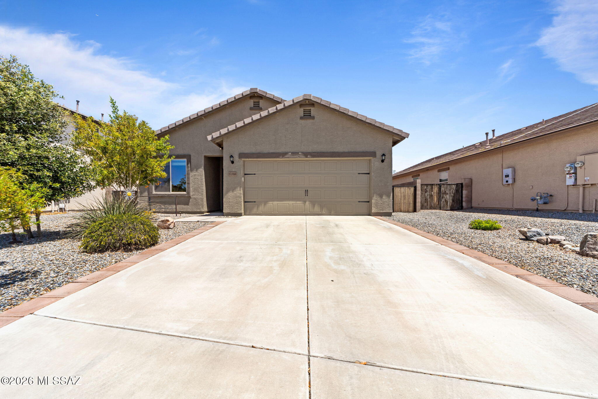 Discover this beautifully cared-for home packed with unique upgrades! Enjoy elegant tile floors that flow through most of the house and stunning granite countertops  that make the kitchen a true centerpiece. The spacious, open floorplan creates a seamless flow between living spaces, perfect for gatherings or relaxing evenings. Step outside to your own private oasis--the backyard is expertly landscaped to provide a serene retreat. Plus, abundant storage solutions help keep everything organized and clutter-free. Located just off I-10, this home offers easy access to city life while being steps from a peaceful park, scenic walking trails, and a friendly dog park. It's the perfect blend of comfort, style, and convenience!