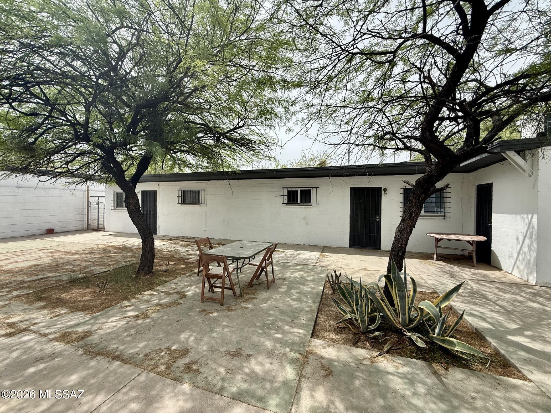 This cozy 425 square foot, 1 bedroom, 1 bathroom single-story unit offers comfortable living in Tucson. The kitchen comes equipped with essential appliances including a refrigerator, oven, and microwave, providing everything needed for daily meal preparation. The living room features ceiling fans for enhanced comfort and circulation throughout the space. Beautiful tile flooring flows throughout the unit, offering both style and easy maintenance. The bedroom provides a peaceful retreat with ample natural light, while the full bathroom serves your daily needs efficiently. Laundry facilities are conveniently shared within the building, adding to the practical amenities of this home. Climate control is provided by an AC unit to keep you comfortable year-round in the Arizona climate. Street parking is available for residents and guests. The location offers easy access to Tucson's dining, shopping, and entertainment options, making this an ideal choice for those seeking affordable living in a convenient setting.