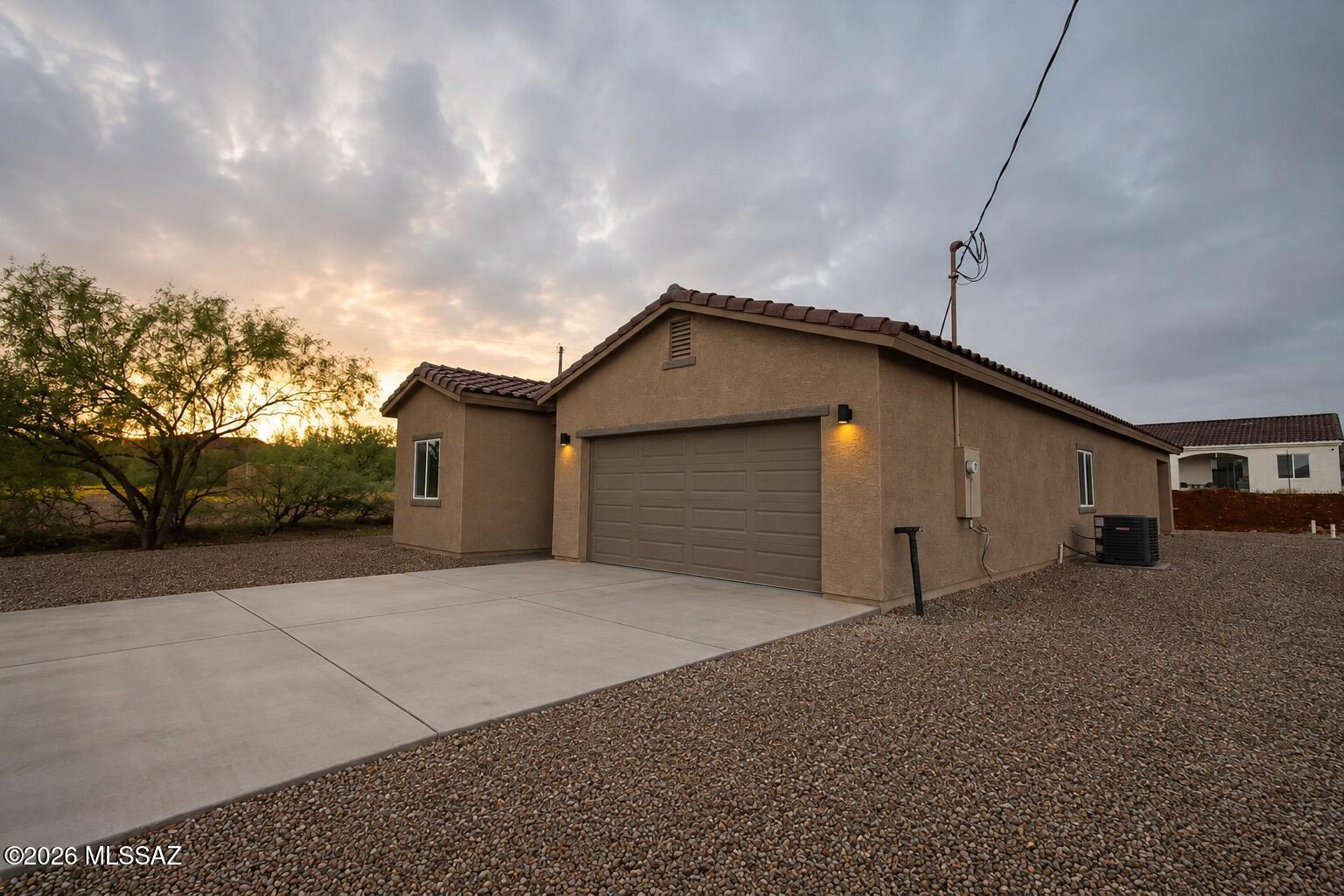 Welcome to this beautiful newly built home in peaceful Rio Rico, offering modern comfort, stunning mountain views, and a serene setting. Enjoy the beauty of the surrounding landscape from your home while taking in breathtaking sunsets and the quiet atmosphere of the area.
This thoughtfully designed home features a fresh, modern feel with spacious living areas, a bright and inviting layout, and quality finishes throughout. The peaceful surroundings make it an ideal place to relax, entertain, and enjoy the Arizona lifestyle.

Located in the scenic Rio Rico area, you'll have easy access to nearby shopping, dining, outdoor recreation, and the charm of Southern Arizona, while still enjoying the privacy and tranquility of your own home.

Come see this beautiful new home!!!