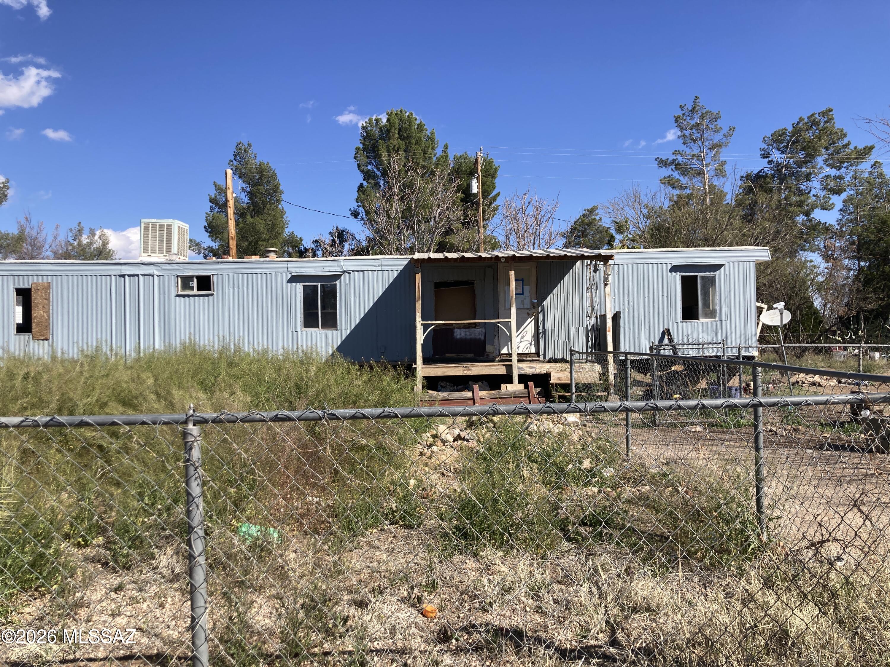Whetstone - Unaffixed mobile home behind the Fire hall - fix up property - large lot - Two singlewide mobiles put together - lots of potential