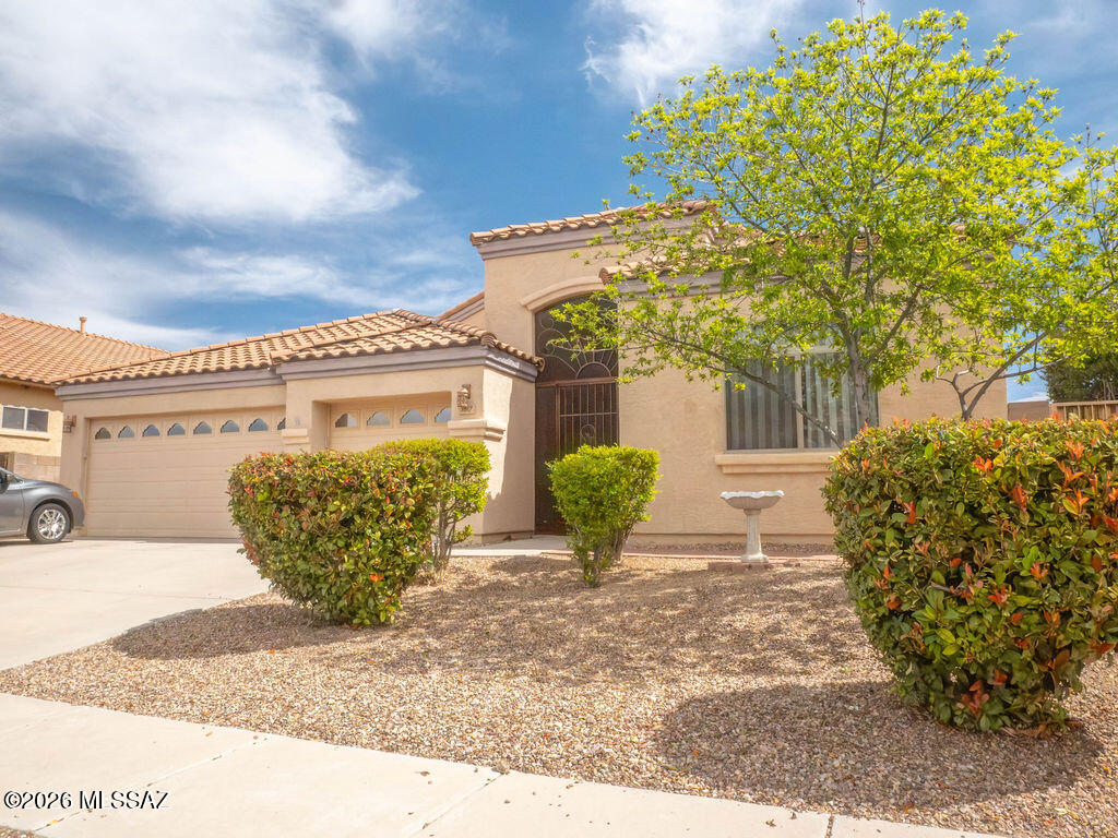 This Beautiful family home in Gorgeous and Peaceful Tucson Mountain Sanctuary subdivision offers Four bedrooms, den(off kitchen), Soaring ceilings and an open floor plan. Three car garage and a great size backyard oasis featuring low care Turf and desert  landscaping with a spool to cool off during summer days. Anyone say night swimming...? Stainless steel and black appliances, island seating, and great  natural light. private primary ensuite with glass patio door for yard access, with dual vanities, garden tub, shower, & a walk in closet. Enjoy your mountain views sipping lemonade while relaxing or entertaining. New shopping nearby and minutes fro Sahuaro National Monument, and so much more...
