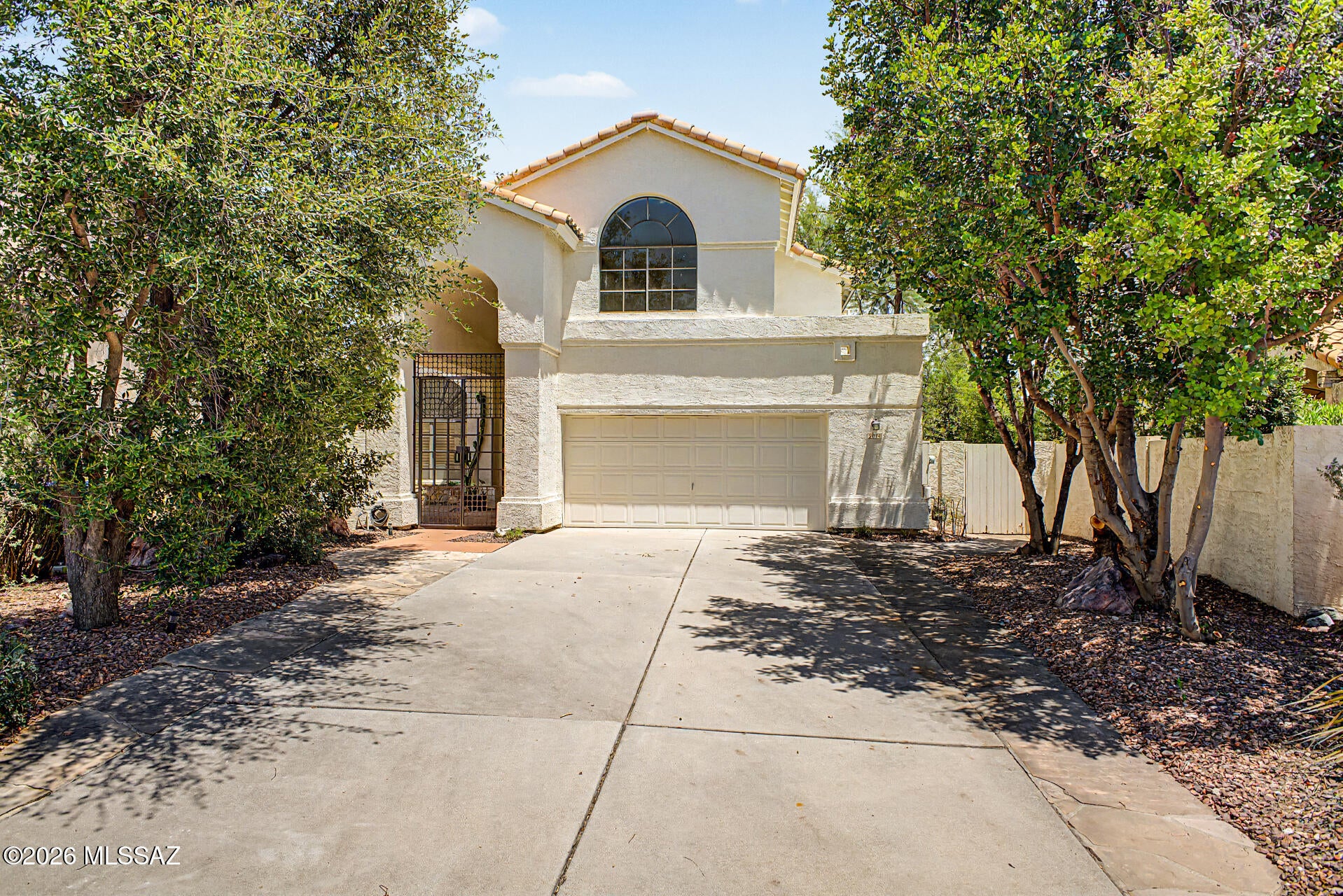 Rare opportunity to own a spacious home on a premium lot with unobstructed Catalina Mountain, Tanque Verde and Sabino Canyon views. Offered as-is, this home is ready for your personal updates while featuring exceptional custom builder modifications, including 4 fireplaces, a wet bar, two laundry areas (upstairs and downstairs), two bonus rooms, an expanded upstairs bedroom, full downstairs bath, workshop addition with skylight, garage workbench/storage, front courtyard with wrought iron gates, covered patio, balcony off the primary suite, flagstone patio with fire pit, and built-in BBQ connected to natural gas. Endless potential in a truly special setting.