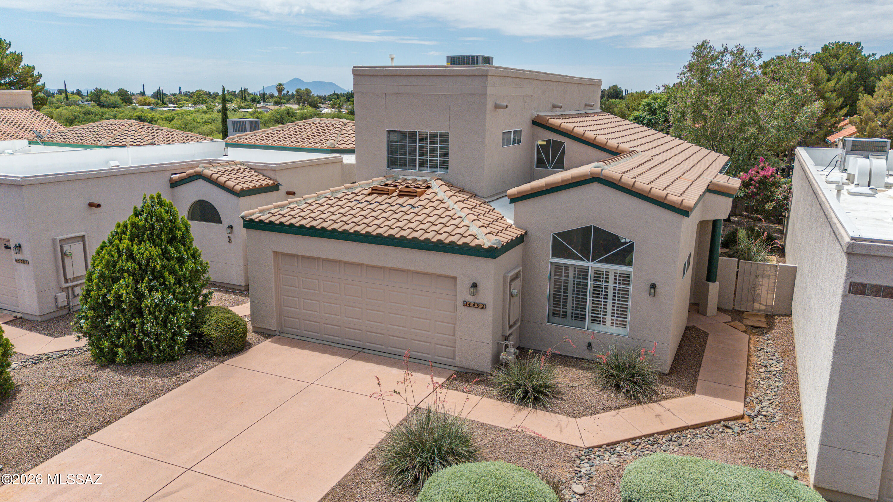 Beautifully maintained 3-bedroom, 2-bath home located in a desirable gated community with a central location close to shopping, dining and everyday conveniences. This inviting home features a flexible office and a separate dining room/den, providing plenty of space for work, entertaining, or relaxation. Enjoy a low-maintenance backyard with attractive astro turf, perfect for year-round enjoyment.  A covered back patio creates an ideal space for outdoor dining, gatherings, or simply unwinding in the shade. Additional highlights include a 2-car garage,  and excellent curb appeal. Pride of ownership is evident in every detail.