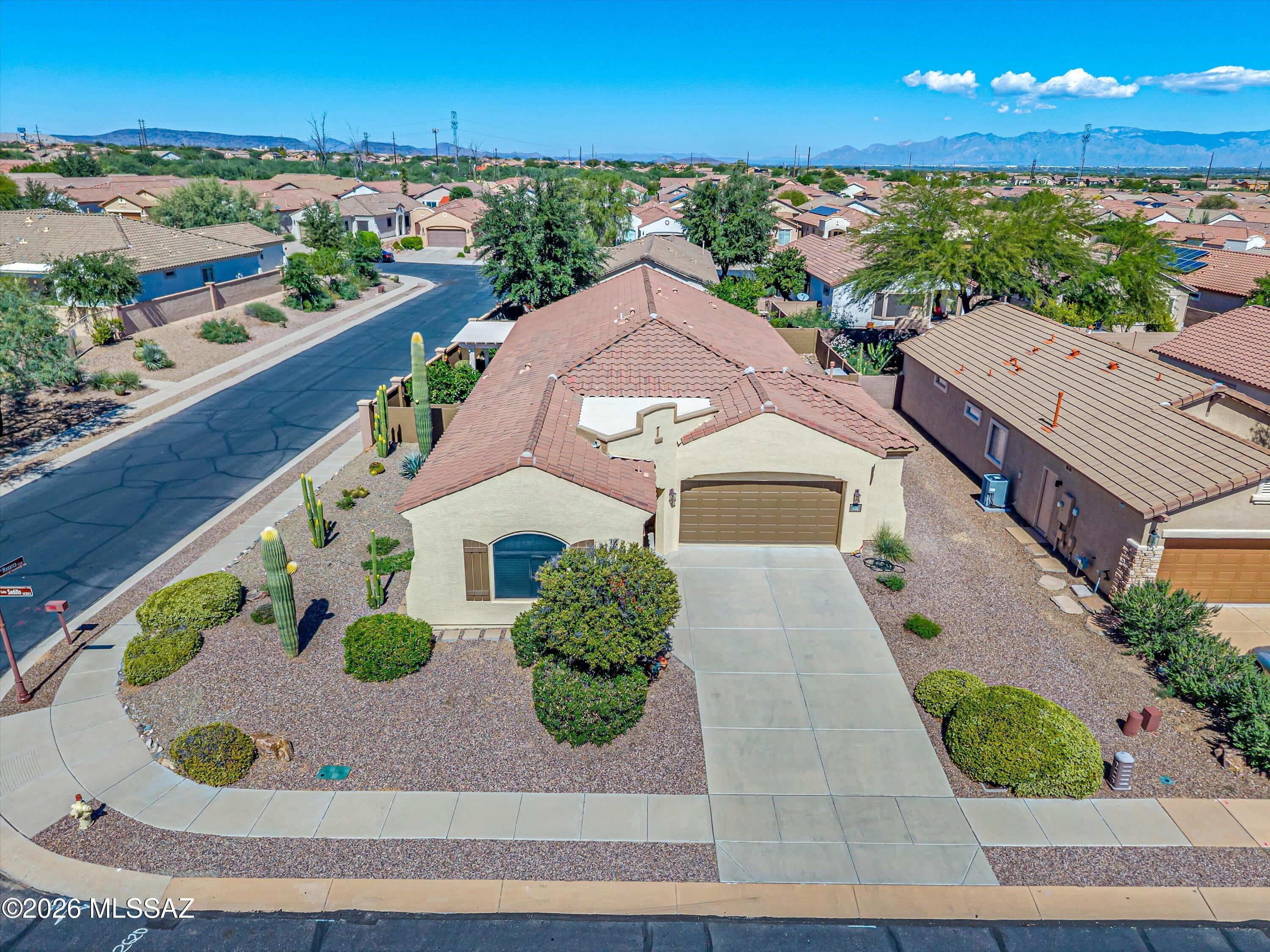 Space for guests, crafts, hobbies, privacy and gatherings comes naturally in this one-of-a-kind
home in the 55+ Sonora by Del Webb community. Originally a sales center/model home, not
only does it feature the largest square footage (2,483) and lot size (.19 acres) in the
neighborhood, it's also the only home in Sonora with 4 bedrooms, a large walk-in pantry, and an
oversized garage. The garage features lots of built-in storage, double sized workbench and a new epoxy finish on the floor. This home has soaring ceilings which offer a spacious feeling along with six lighted ceiling fans. With the major updates like a new water heater (2026), water softener (2025), exterior paint (2024), and HVAC (2022) taken care of, you can spend your time relaxing in the shady backyard surrounded by four citrus trees, mature landscaping, and dozens of colorful Mexican ceramic Talavera desert animals.
You'll also have time to craft or game in the multi-purpose bonus room, cook in the upgraded kitchen, and swim at the clubhouse located just steps from your front door. Colorful Talavera light switchplates throughout the home add a colorful and festive appeal. Enjoy the oversized backyard paver patio with a care free pergola and sun baffle for shade in the afternoons, bar-b-queing for dinner and a fire pit for cool evenings. All southern and
western facing windows have heat blocking screens to prevent glare and excessive summer heat. The multi-purpose bonus room is a standout with its wet bar, cherry cabinets with granite
counters, and an added pocket door for privacy. The open kitchen is the heart of the home with upgraded cherry cabinets, granite counters and a large island with a breakfast bar. It features
a newer (2024) tile backsplash, stainless steel appliances, and a walk-in pantry. The remodeled primary bathroom features a care free walk-in ceramic tiled shower. This home's features and
upgrades are extensive! See documents for full list. All furnishings are negotiable. With a home in excellent condition like this one, you will have more time to enjoy the exclusive Sonora Clubhouse--meeting neighbors, making friends, playing pickleball, swimming in the heated pool, and so much more.