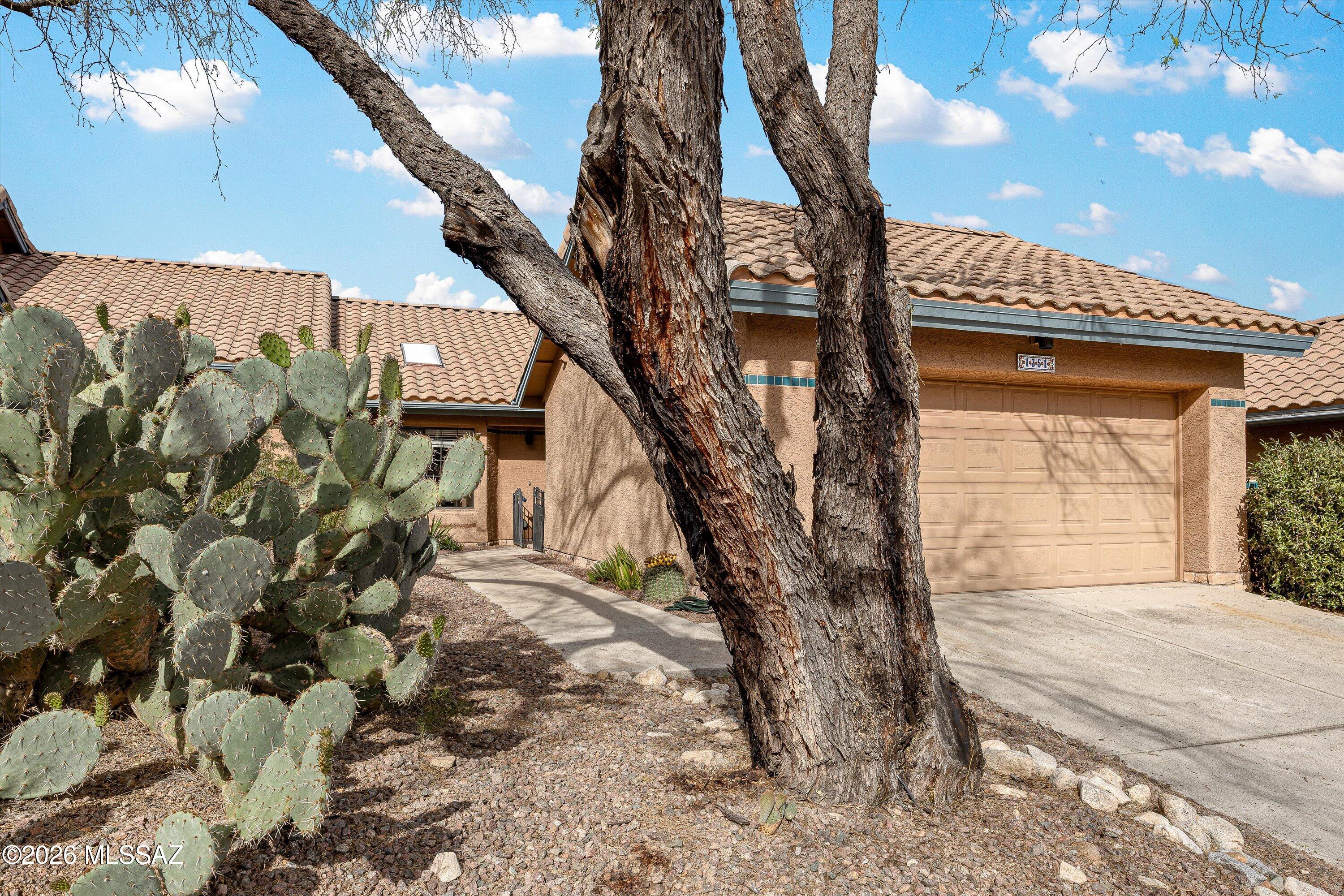 Welcome to this warm and inviting townhome located in La Reserve. The home offers 1,114 square feet of comfortable living space with two bedrooms and two baths. A quaint walkway gently leads you into the home. Efficient kitchen features granite countertops with updated stainless steel appliances.The great room provides a comfortable  space for entertaining or gatherings for meals. The primary bedroom is tucked away in the rear of the home and features an updated en-suite bath with granite counters and updated step-in shower. Guest bedroom is of good size and located near a guest bath providing comfort and privacy for visitors. The private backyard is a peaceful retreat an ideal spot to relax or read book. The  natural desert behind the home creates a scenic backdrop to enjoy wildlife.
