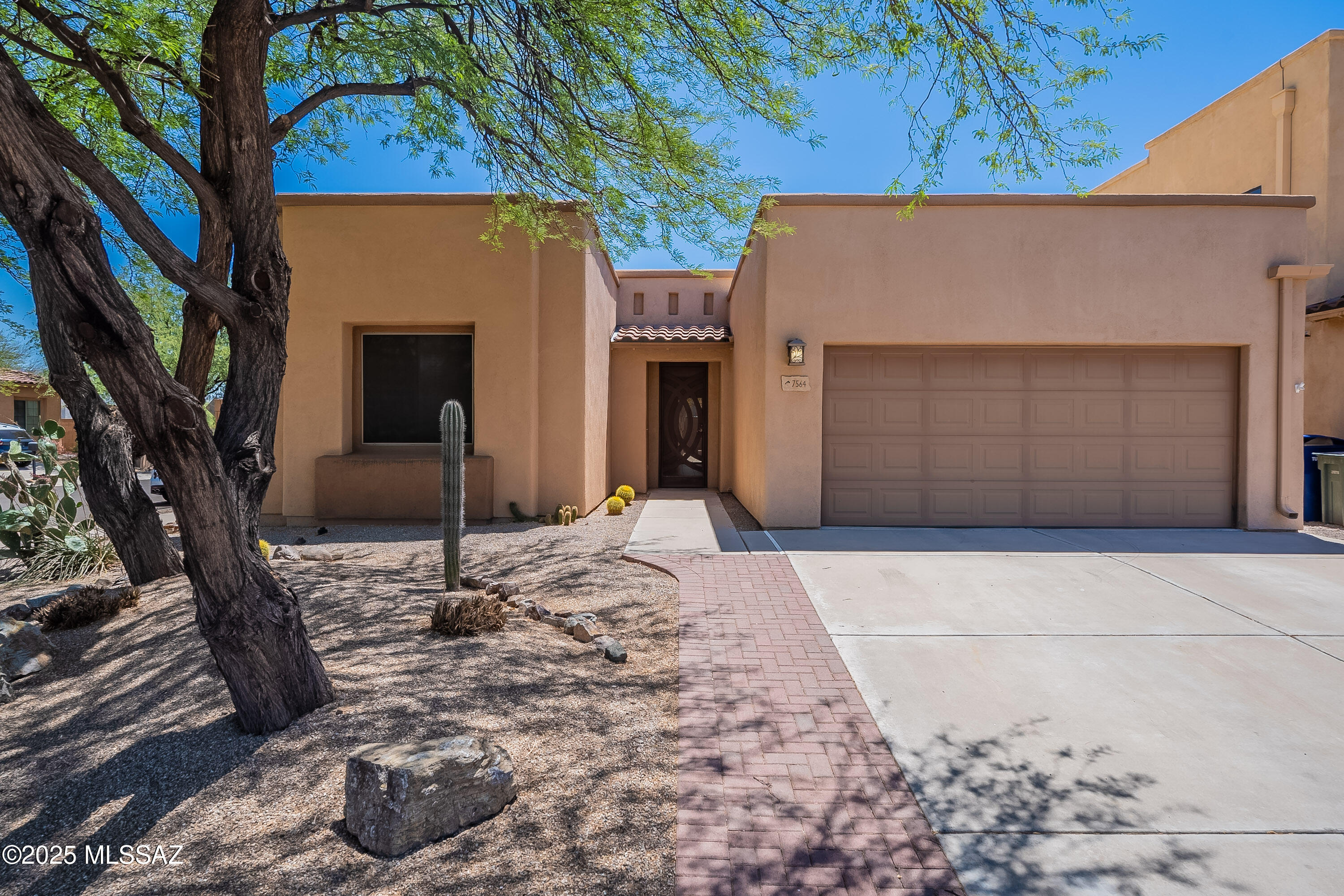 Step into this stunning Pepper Viner-built home with 3 bedrooms, 2 baths.  Paid off solar, enjoy lower electric bills all year long! The large kitchen has stainless steel appliances, gas stove, newer dishwasher.  Large breakfast bar with pendant lights so everyone can sit and enjoy a meal.  There is also eat-in-nook off of the kitchen and an oversized pantry.  The great room has dual sliding doors to the large backyard.  There is a covered patio & pavers, but room to garden and you can utilize the water harvesting system.  Fenced yard for privacy.  Ideally located near Udall Park for a swim, dog park or game of pickleball.  Also, easy access to the River Walk.  Garage is extended for cars and exercise equipment utilizing the mini split a/c.  Also overhead storage in garage. Primary bedroom has wood floors, bay window to the backyard and 2 large closets.  Primary bathroom boasts dual sinks, large vanity & walk-in shower. So many upgrades throughout, come see for yourself!
