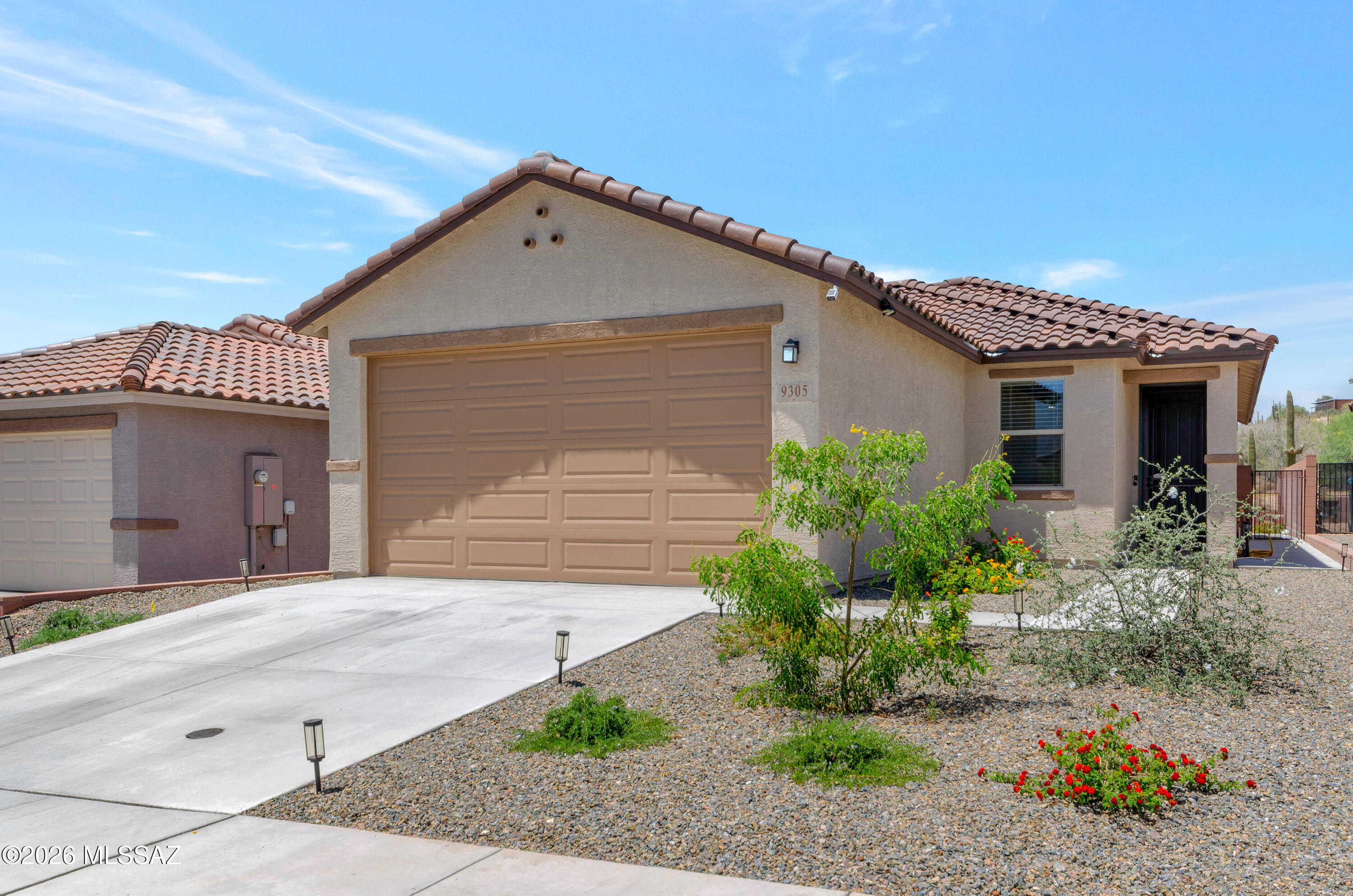 Welcome to Vista Del Oro, NW Tucson, living as it was designed to be enjoyed. This beautiful single-story home features a spacious split 3-bedroom, 2 full bath and functional den/office floor plan for flexible living options. The modern kitchen, with new appliances, recessed lighting and expansive island/eat in breakfast bar opens up to the great room for  open space entertaining or ample comfort. Primary suite boasts a walk-in closet, ensuite bath with full shower and extended dual sink vanity. The private  backyard with expanded patio concrete pad, landscaped gravel, drip system, radiant flora, and view fence makes for a quiet and relaxing retreat. Enjoy wildlife and bird watching on mature saguaro cacti and hillside trees. Morning sunrises & evening sunsets. Easy access bike loop. Home!