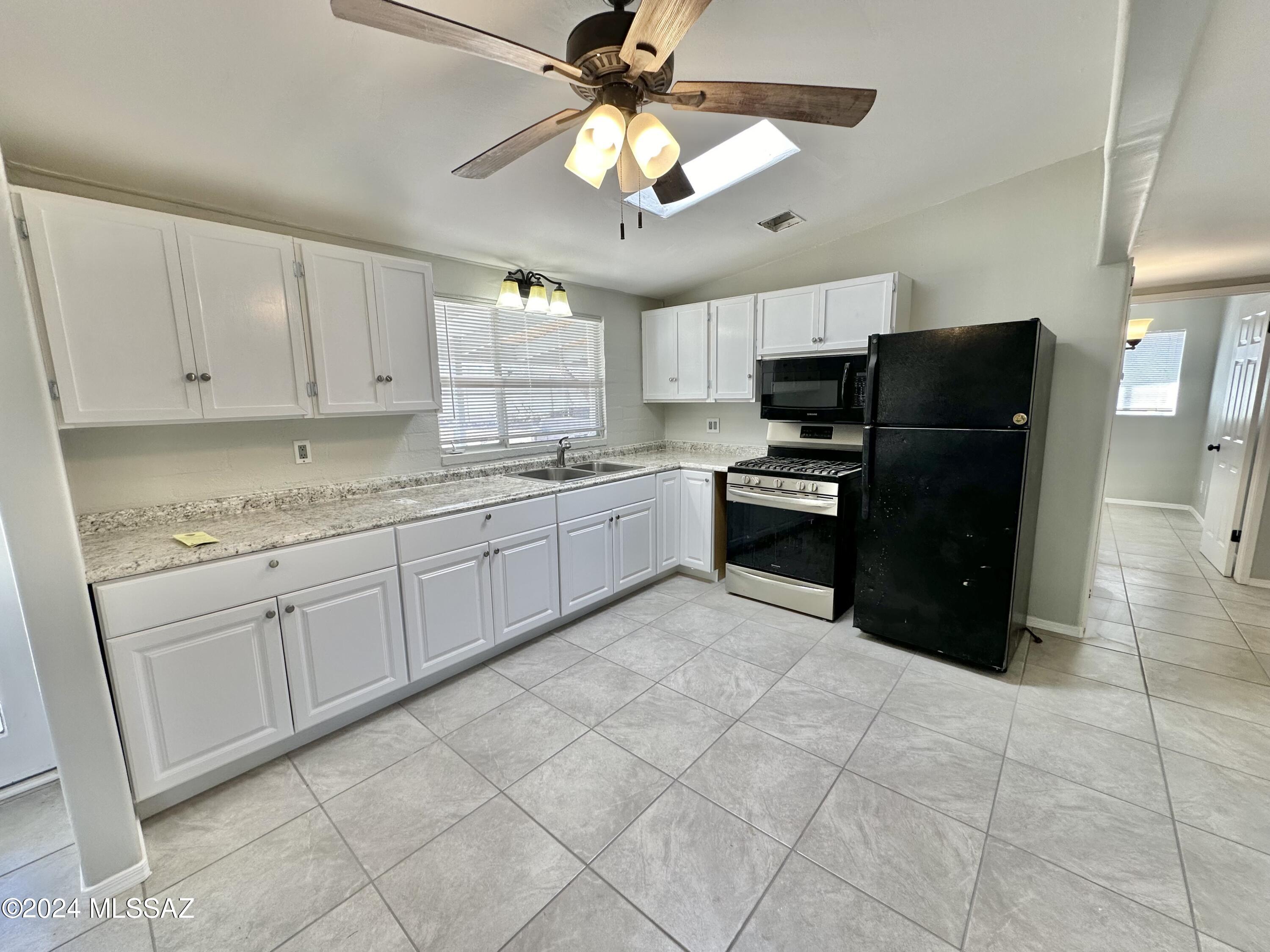 Move-in ready, completely remodeled 4-bed 2-bath home with central AC! New appliances, new paint, new air conditioning system. Interior features tile flooring through out, ceiling fans, and a large expanded primary bedroom with additional storage /closet area. The large fenced-in backyard features a storage shed, and incredible mountain views. Available for move-in right away! Owner pays the monthly sewer bill, but tenant pays all other utilities.
