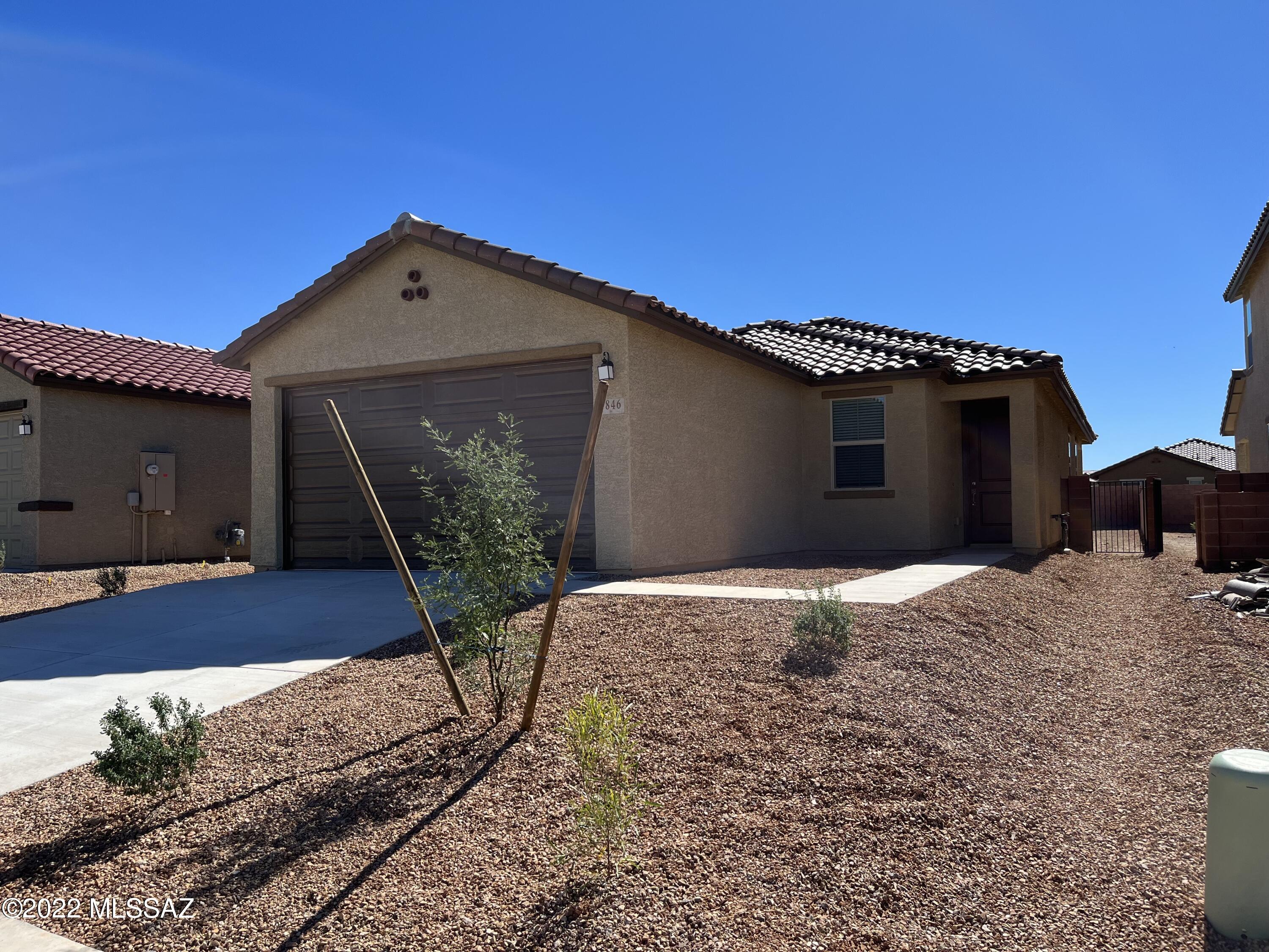 Welcome to the Beautiful Gated Community of Silver Ridge at Rocking K Ranch! Upgraded 4 bed 2 bath home features 9' ceilings, white cabinets, stainless appliances, gas range, 18'' X 18'' tile floors, carpet in  bedrooms only, primary bath has oversized walk in shower and dual vanities. Home is 1 block from park, basketball and pickleball courts, beautiful mountain views! Located 13 minutes to major grocery store, 20 minutes to UA tech Park and 26 minutes to Tucson Intl. Airport. Welcome Home!