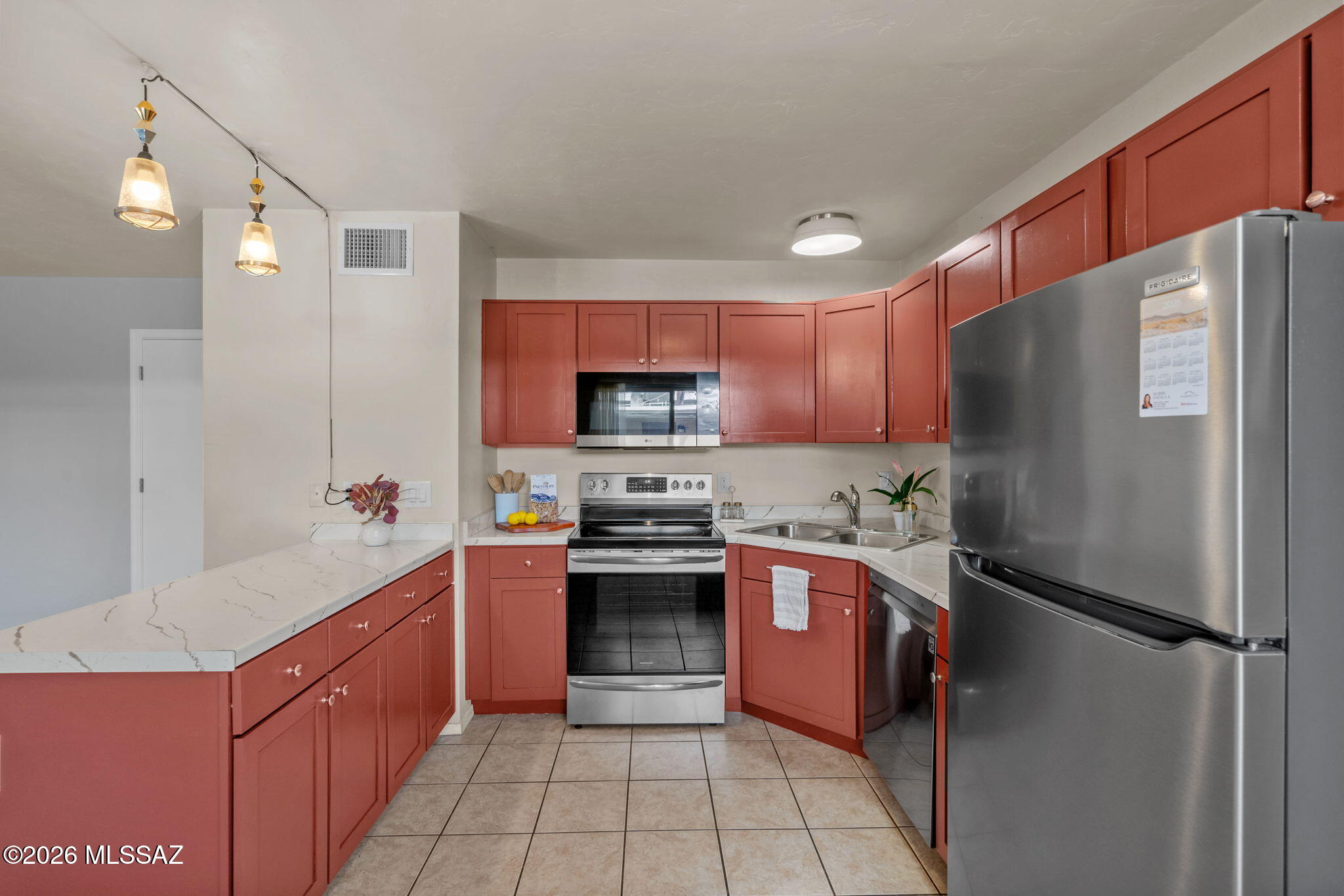 Enjoy the ease of ground-level living in this beautifully maintained Tucson condo, where comfort and convenience come together. Bright, inviting living spaces and a functional open layout create a warm atmosphere that's perfect for everyday living or entertaining. The well-appointed kitchen flows seamlessly into the dining and living areas, while the private covered patio offers a peaceful spot to enjoy your morning coffee or unwind at the end of the day. With a low-maintenance lifestyle, easy access, and a prime central Tucson location near shopping, dining, parks, and medical facilities, this charming home is ready for you to move in and enjoy.
