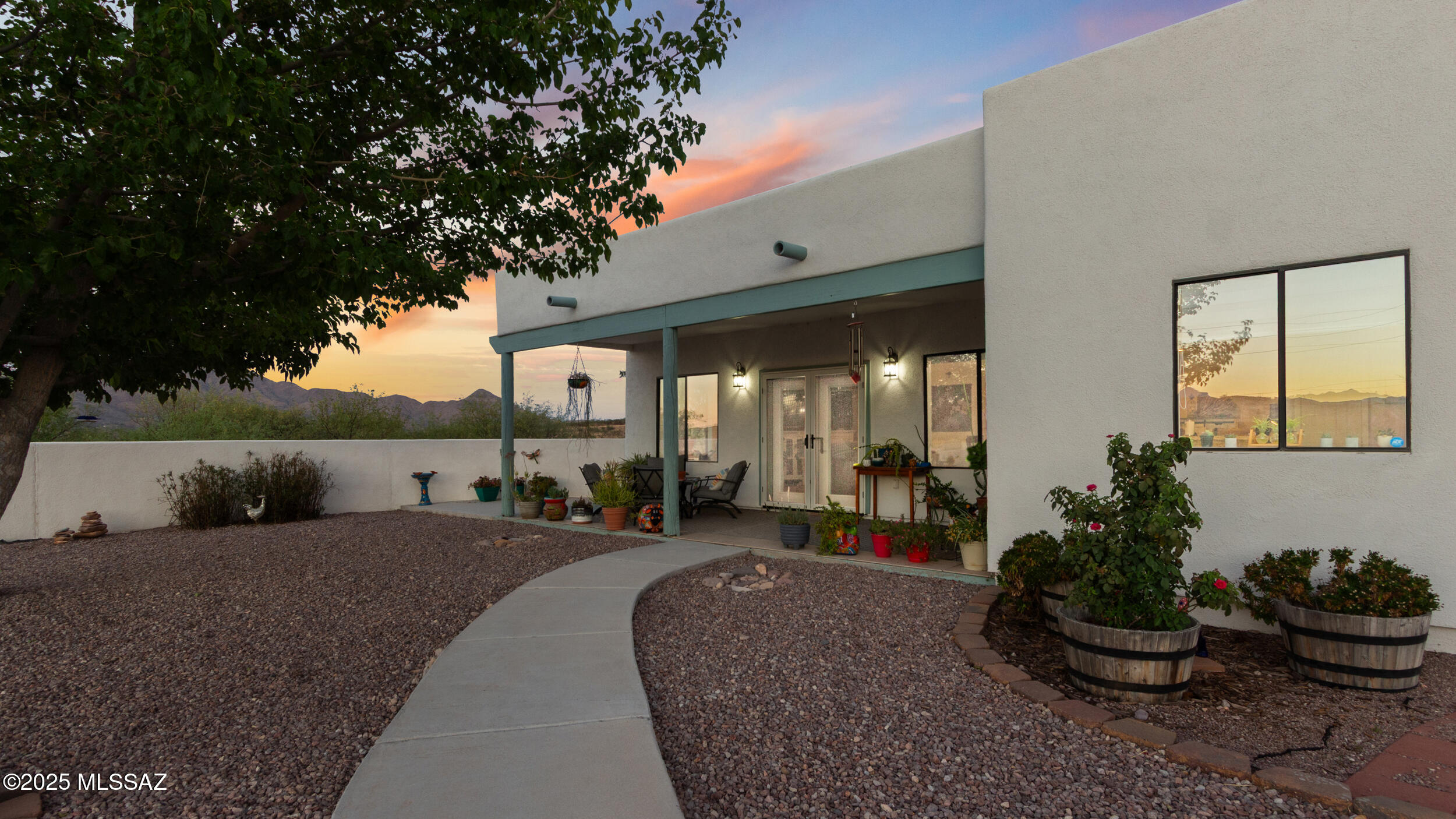 Experience the pinnacle of Southern Arizona living on 6.19 acres of breathtaking high-desert landscape. This 3-bedroom, 2-bath retreat offers unparalleled 360-degree views of the surrounding mountain ranges, where sunrises and sunsets paint your daily backdrop. The heart of the home is an expansive great room that flows seamlessly into a private walled courtyard--the ultimate setting for stargazing or sophisticated entertaining. With a remodeled kitchen featuring stainless steel appliances and a whole-house water filtration system, every modern convenience is accounted for. 
From the massive acreage ready for your outdoor gear, to the quiet beauty of the local wildlife, including bird watching and start gazing, this property offers the serenity and space that only Rio Rico can provide. Are you ready to call the mountains of Rio Rico home?