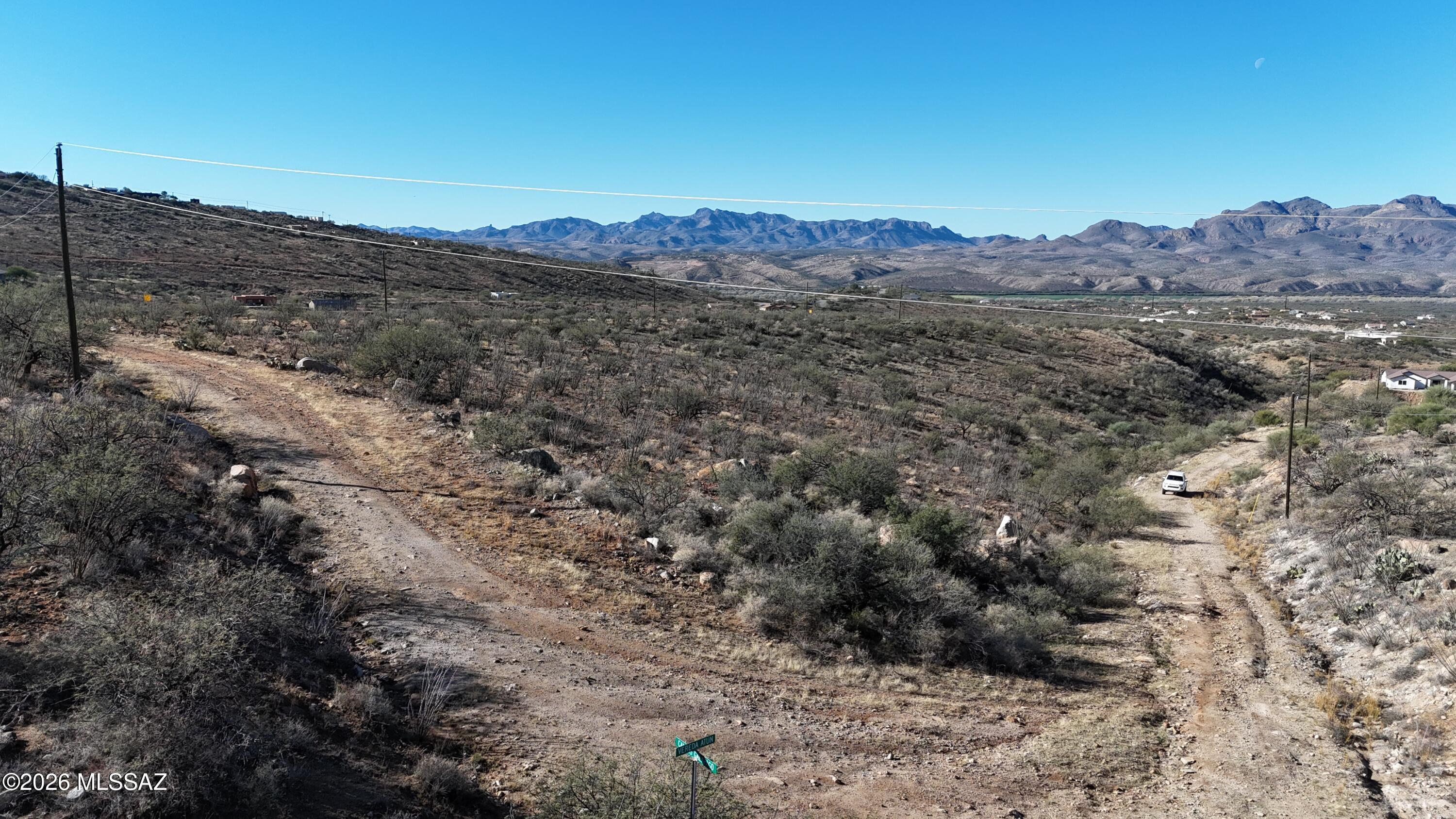 Corner lot with Electric and water service at the street.  Mountain views.