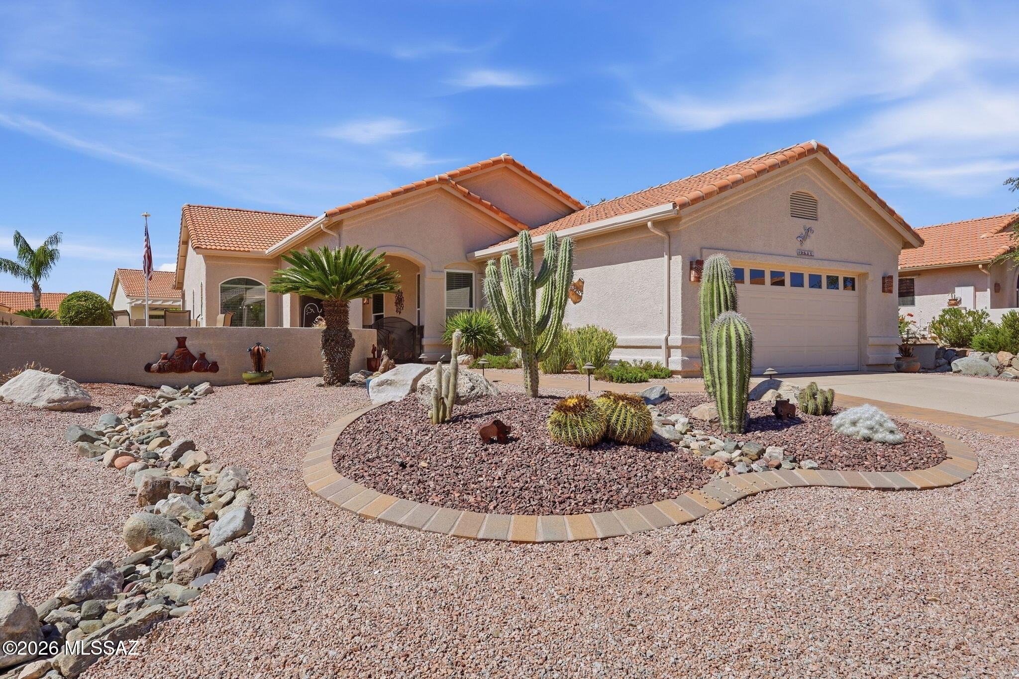 Discover an impeccably upgraded sanctuary in the highly acclaimed SaddleBrooke active-adult 55+ community. Delivering 2BD/2BA (2,050 sqft) this Fiesta model balances architectural character with beautiful modern enhancements. Designed with a completely step-free layout, the property stands out by offering spectacular, front-row views of the local mountain ranges directly from your living area. Pass through the welcoming front entry foyer to discover a light-filled environment dressed in a modern neutral palette and anchored by a modern LED lit fireplace. The beautifully updated chef's kitchen comes complete with solid quartz countertops, rich wood cabinetry, and high-quality stainless-steel appliances. The open living room features soaring high ceilings and massive windows that frame the high-desert landscape perfectly while drawing in a steady stream of Southern Arizona sunshine. The floor plan configuration provides two spacious bedrooms and two fully updated bathrooms, including a serene primary retreat featuring generous closet storage. The indoor common spaces transition smoothly outdoors onto a covered back patio. Low-care desert landscaping allows you to spend less time on yard maintenance and more time enjoying morning coffee or evening dining alfresco under the shade of the patio. Practical infrastructure assets offer absolute peace of mind including an updated HVAC unit and instant gas water heater. Living on Mountain Site Drive drops you right into an enviable resort lifestyle. Residents enjoy premium neighborhood proximity to SaddleBrooke's elite recreation network, including championship golf courses, active tennis and pickleball complexes, resort-style swimming pools, putting greens, and a modern fitness pavilion.