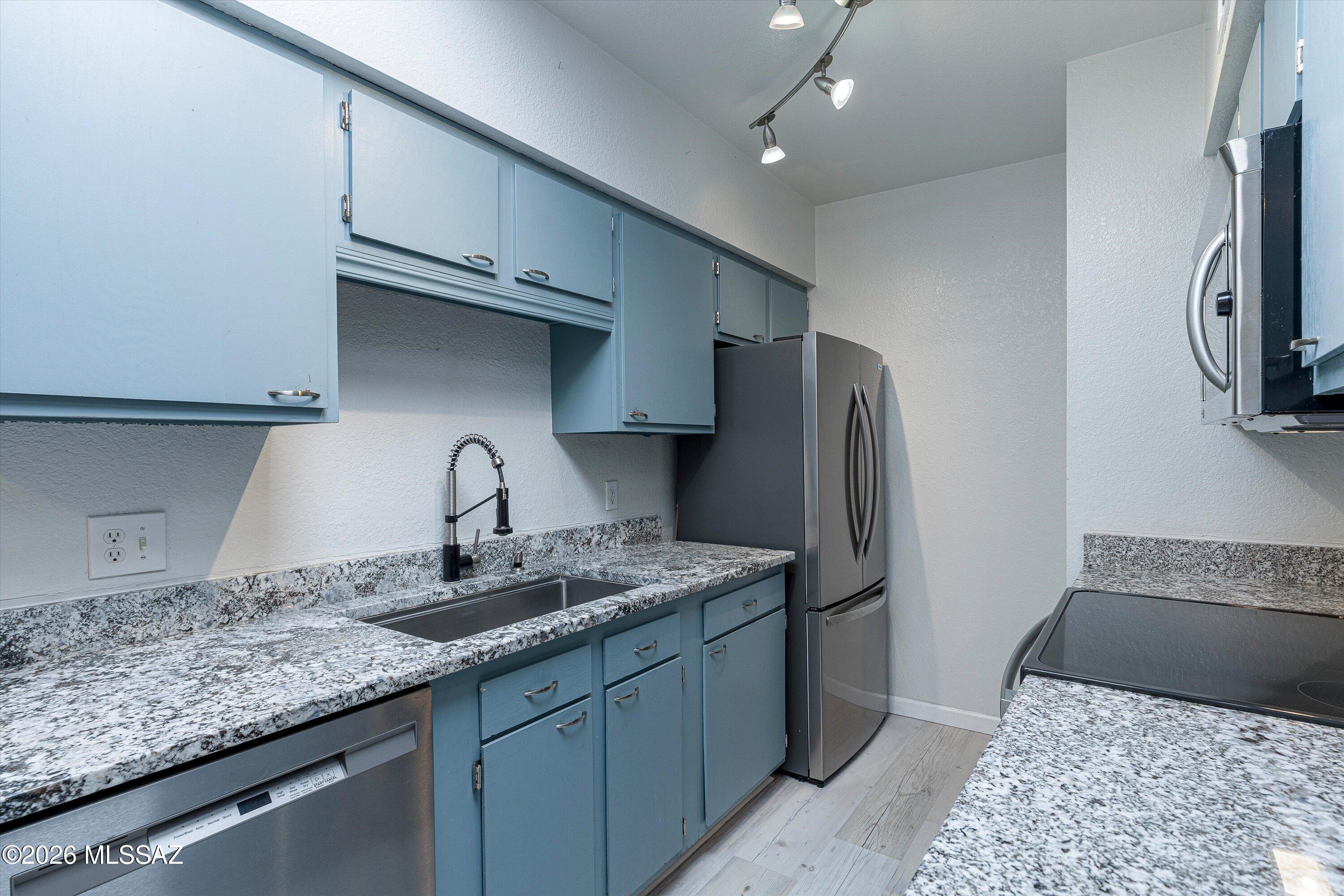 What a great East side condo right across from pool!!!!!  2bed/2bath split floor plan.  Wood look LVT floors, NO CARPET! Updated kitchen with Granite countertops and Updated bathrooms. All newer appliances convey. Newer HVAC.HOA covers the roof, trash, termite, water, exterior maintenance, and front landscaping, pool & spa. Covered parking #6.