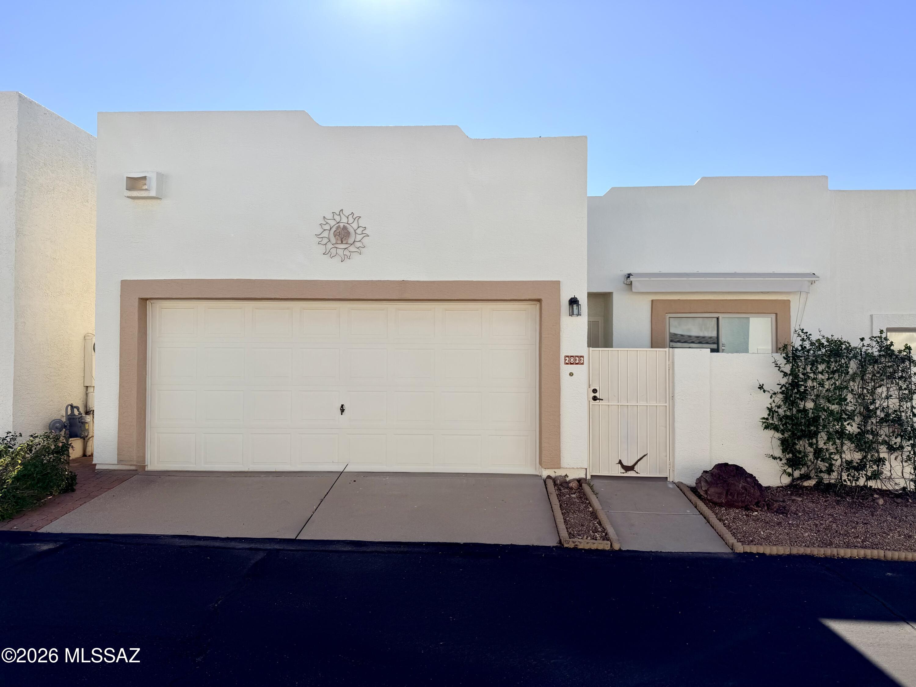Welcome to this charming home in a desirable gated adult community, where comfort, convenience, and community come together.

This well-maintained residence features a spacious open great room floor plan with two large bedrooms, generous storage, and a bright, inviting feel throughout--enhanced by multiple skylights that bring in beautiful natural Arizona light. Recent updates include fresh interior paint, ceiling fans, and a well-functioning A/C system. The home is move-in ready and includes all appliances--refrigerator, washer, and dryer--making for a seamless transition. Enjoy the added benefit of owned (paid-off) solar, providing energy efficiency and long-term savings.

Enjoy the flexibility of a 2-car garage and not one, but two private patios--perfect for morning coffee, relaxing evenings, or entertaining guests.
One of the standout features of this community is its rare pet-friendly HOA, complete with a dedicated dog run. Even better, you can walk your pets right within the neighborhood--no need to load up and head to a park. Residents also enjoy a refreshing community pool and a welcoming, friendly atmosphere that makes this neighborhood especially sought-after.

No Seller Property Disclosure Statement (SPDS) or CLUE report will be provided.

Don't miss this opportunity to own in a well-loved community with amenities and lifestyle perks that are hard to find!