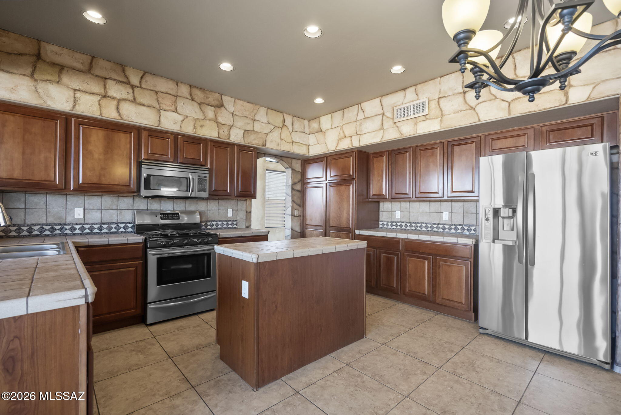 Beautifully maintained and truly move-in ready, this one-owner 4-bedroom, 3-bath home is located in the highly desirable Bella Vista neighborhood. The property showcases breathtaking mountain views and reflects pride of ownership throughout. The thoughtfully designed floor plan is enhanced by premium interior paint and abundant natural light. The spacious primary suite offers a peaceful retreat, complemented by two additional bedrooms and two full baths on the upper level. The lower level features a private guest bedroom with a full bathroom, ideal for visitors or multi-generational living. This is a rare opportunity to own a pristine home in an exceptional location.