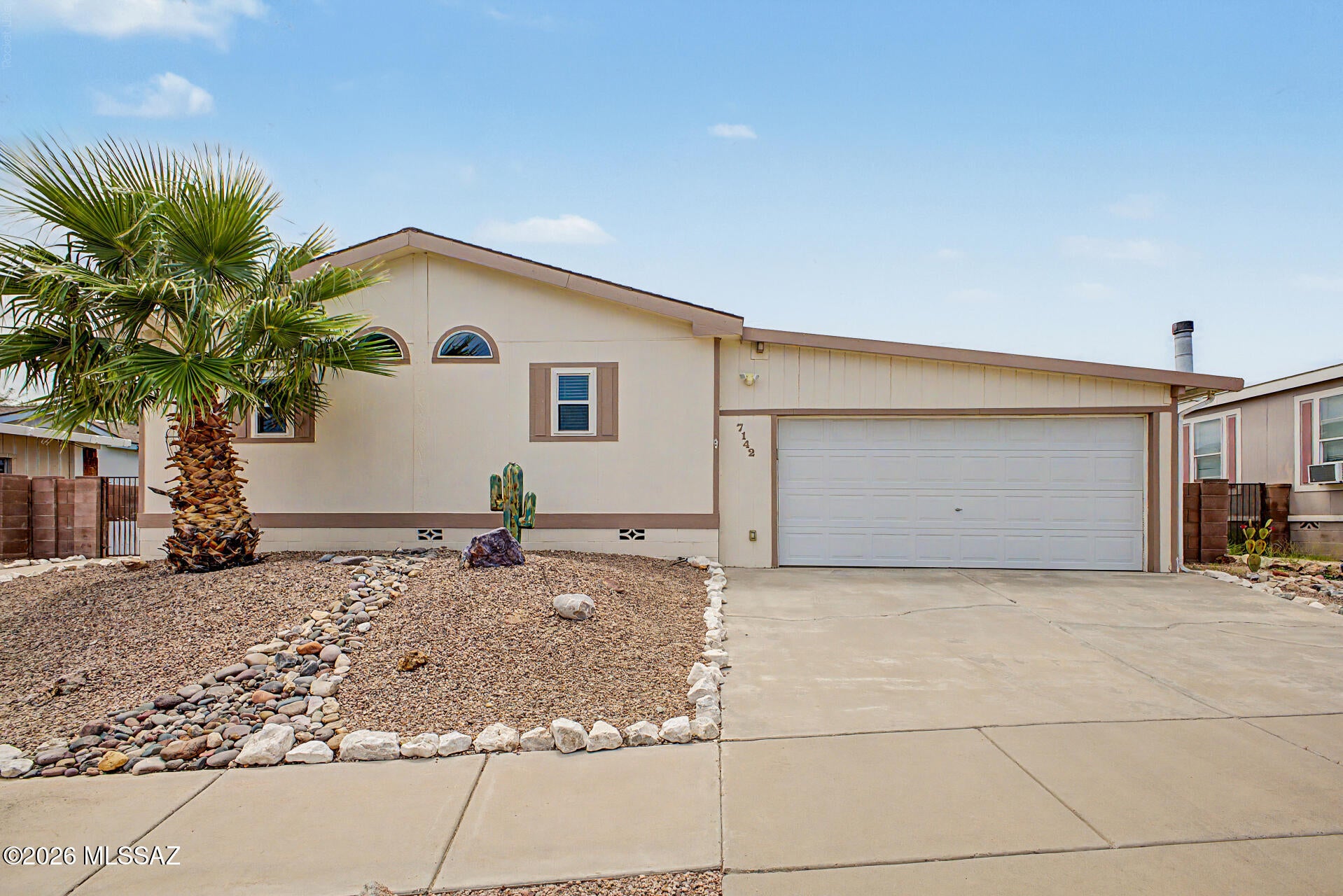Welcome Home to this lovely, well-maintained 4-bedroom, 3-bathroom home located in the gated Window Rock East community! Close to DMAFB and I-10, this 2,128 sq ft home features a split bedroom plan, separate living and family rooms, and his-and-hers primary baths connected by a spacious walkthrough closet. An accessibility ramp provides easy access, and don't miss the utility sink in the dedicated laundry room. A fully landscaped backyard, covered patio, built in bbq, and pergola is perfect for weekend gatherings, and a huge Tuff Shed is great for storage, a workshop, or even a hobby space. Recent updates include a new HVAC system (2024), new refrigerator (2025), and a new water softener installed in March 2026. Community pool and park included. Don't miss out on this lovely home!