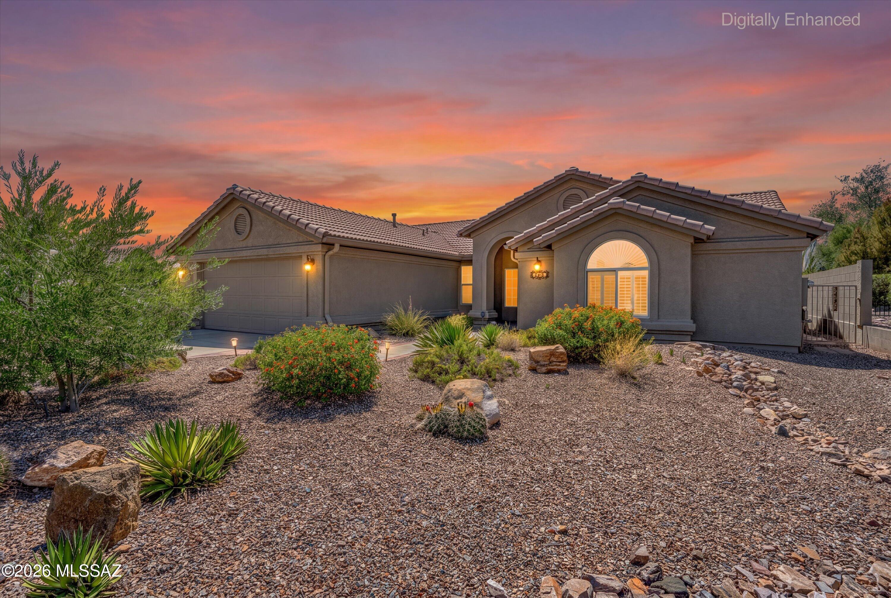 Tucked along a quiet semi-cul-de-sac, this beautifully appointed 2-bedroom plus den Topaz model offers a blend of privacy, comfort, and effortless indoor-outdoor living. Upon entering, the living room is welcoming with a gas fireplace setting a warm focal point and windows that draw the eye to lush, mature landscaping beyond. The updated kitchen is both stylish and functional, featuring generous cabinetry, granite countertops, and a sun-filled breakfast nook--the perfect setting for morning coffee or relaxed conversation. Designed for easy everyday living and entertaining, the kitchen flows seamlessly into the family room and out to the inviting backyard retreat. The primary suite is a serene escape, complete with direct patio access and a beautifully updated en-suite bath with dual vanity a spacious step-in shower, and walk-in closet. Guests will appreciate the comfortable secondary bedroom, with a window seat, walk-in closet, and convenient bath access, while the centrally located den provides flexible space for visiting guests or a private office. A spacious laundry room with built-in storage adds thoughtful practicality. Outdoors, the extended paver patio and expanded ramada create an elevated setting for entertaining or unwinding beneath the desert sky, surrounded by mature landscaping that enhances the home's intimate, secluded ambiance. Graceful, inviting, and exceptionally livable, this SaddleBrooke home offers a refined desert lifestyle in a setting designed to be enjoyed every day.