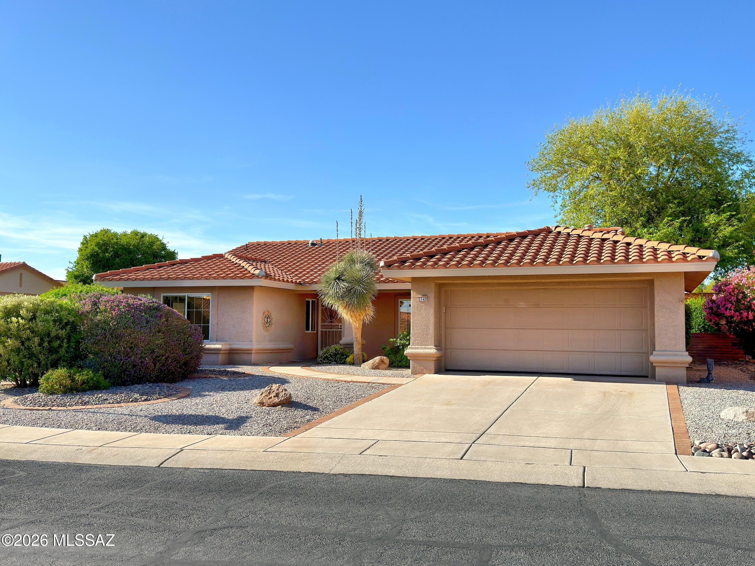 Light, bright & welcoming home in desirable Sun City Vistoso, an active adult community known for its charm, stunning mountain views & beautifully maintained surroundings. This Del Webb Sabino floor plan on a corner lot offers an open great room perfect for everyday living & effortless entertaining, w/ casual dining off the kitchen & formal dining in the great room. Spacious primary suite features bay window seating, walk-in closet & abundant natural light, while the secondary bedroom offers lovely mtn views. Open kitchen includes large window to backyard & bright breakfast nook, creating a warm space to start your day, plus ample counter & cabinet space. Thoughtful layout & inviting spaces make this home both comfortable & functional. More... Flex room currently used as office. Extra-deep garage w/ built-ins, side door, laundry sink, tankless water heater & soft water system. Private backyard w/ aluminum ramada, some mtn views & built-in water feature (not currently in operation). Additional features include solar tube in primary bath & white kitchen cabinetry. Enjoy all that Sun City Vistoso has to offer, including resort-style pools, fitness center, golf, pickleball, tennis, walking paths & a vibrant social calendar... truly embracing the active adult lifestyle.