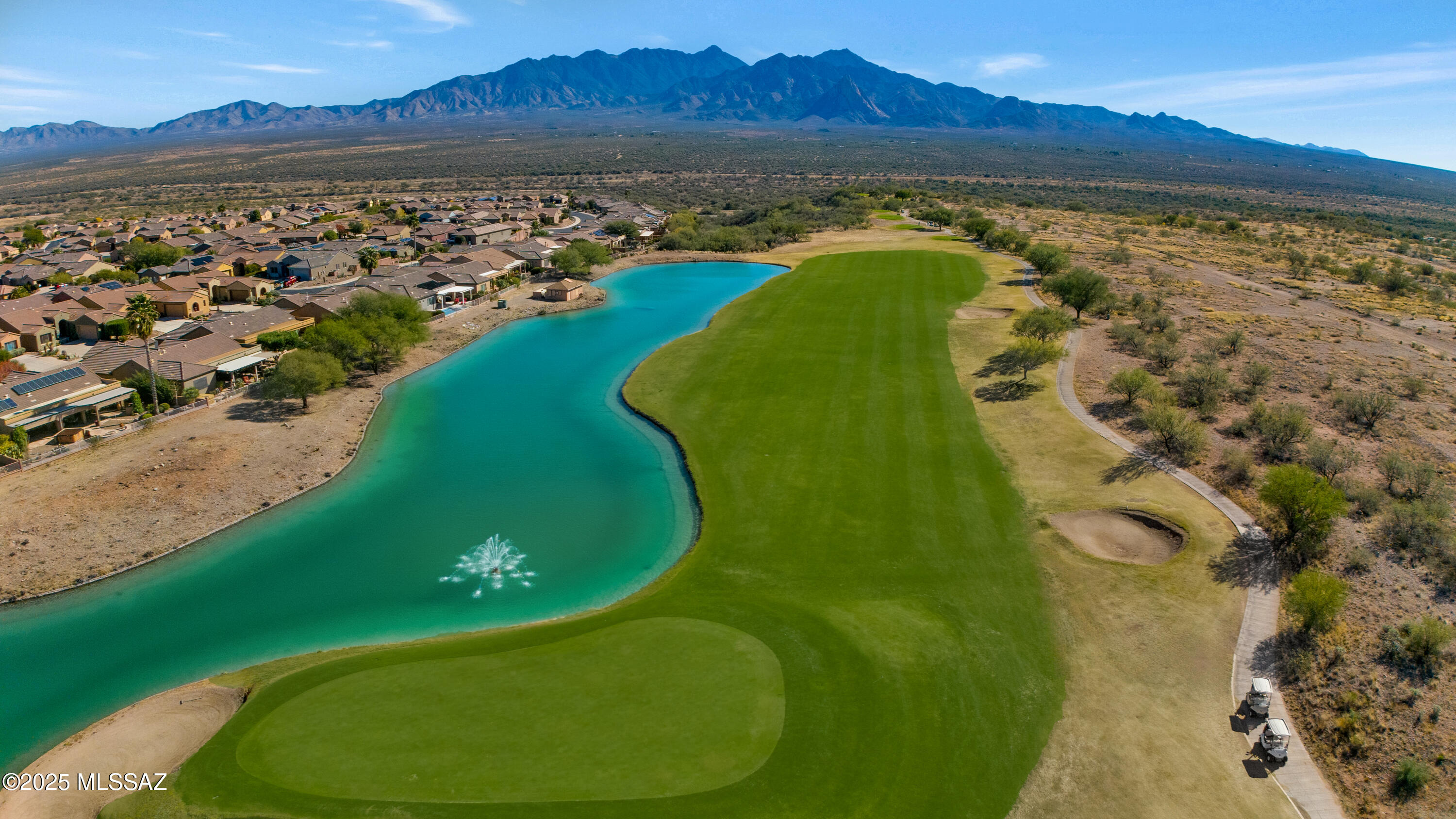 Views, lifestyle, and low-maintenance living all come together in this beautifully maintained townhome in the upscale Canoa Ranch Golf Resort community. Discover front-row, unobstructed vistas of the Santa Rita Mountains and Canoa Ranch golf course from an expansive paver patio that truly feels like an outdoor living room—perfect for morning coffee, sunset cocktails, and entertaining family and friends year-round. From the moment you arrive, the curb appeal stands out with a rustic copper garage door and inviting front entry. Inside, a bright foyer leads to the well-appointed kitchen featuring stainless steel appliances, granite countertops, and ample cabinetry. The kitchen flows into a welcoming great room with a cozy fireplace and a wall of double glass sliders, framing the breathtaking mountain and fairway views while flooding the home with natural light. The thoughtful split floor plan is ideal for privacy and hosting guests. The primary suite is situated on its own wing and offers private access to the back patio through its own sliding door. The en suite bath includes a dual-sink vanity plus a dedicated beauty vanity desk, a generous walk-in shower, and a spacious walk-in closet. On the opposite side of the home, you'll find a comfortable guest bedroom and an adjacent den that can easily be converted into a third bedroom if desired. A generously sized laundry room with washer and dryer included, built-in cabinetry, and a utility sink adds extra convenience and storage. This 2,042 sq. ft. villa offers 2 bedrooms, 2 baths, a den, and an open concept great room-designed for easy living, entertaining, and maximizing the incredible views. Outside, the professionally hardscape paver patio creates a true entertainer's paradise with space for dining, lounging, and enjoying the ever-changing desert sky. The community association delivers outstanding value with comprehensive exterior maintenance, including front and side yard care, regular roof recoatings, scheduled exterior repainting, road resurfacing, and a robust blanket insurance policy. Residents also enjoy full access to Green Valley Recreation (GVR), with multiple rec centers, pools, fitness facilities, classes, and social clubs to enjoy year-round. Furnishings may be available for purchase under favorable terms, making this a truly turn-key, move-in-ready opportunity. Located just moments from the Canoa Ranch golf club, on-site restaurant, GVR amenities, and with quick access to I-19, this townhome is ideal for a low-maintenance winter escape or full-time Southern Arizona living. Don't miss your chance to own one of Green Valley's finest view properties. Schedule your private showing today!