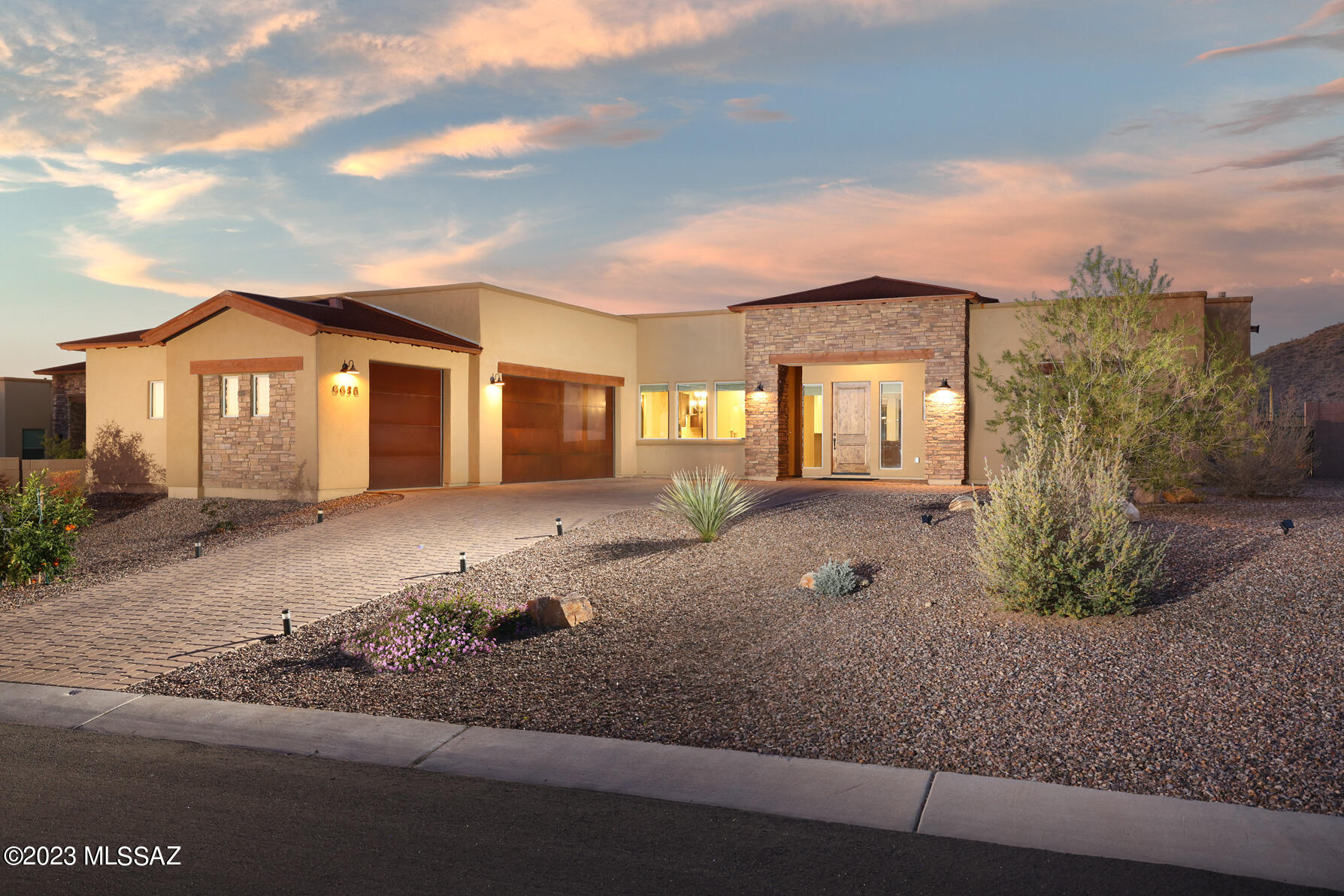 Located within the prestigious gated Boulder Pass community and on the golf course at Golf Club of Dove Mountain. This stunning 4BD/2.5BA home offers 2,602 square feet of refined living space on a quiet cul-de-sac. Upon entry, you are welcomed by an open-concept floor plan featuring tile flooring throughout, 9-foot alder doors, and a dramatic Viga beam ceiling in the great room, creating a seamless flow into the heart of the home. The chef's dream kitchen boasts rich alder cabinetry, granite countertops, and a spacious center island, perfect for both entertaining and everyday living. Owner's suite is generously sized and serves as a private retreat, complete with a spa-like bathroom, walk-in shower, and large walk-in closet. A split floor plan ensures added privacy for guests. Step outside to a spectacular backyard retreat with a pool, covered patio perfect for entertaining or relaxing while enjoying beautiful mountain and golf course views. Conveniently located walking distance to the Ritz Carlton Resort and some of the best hiking and walking paths.