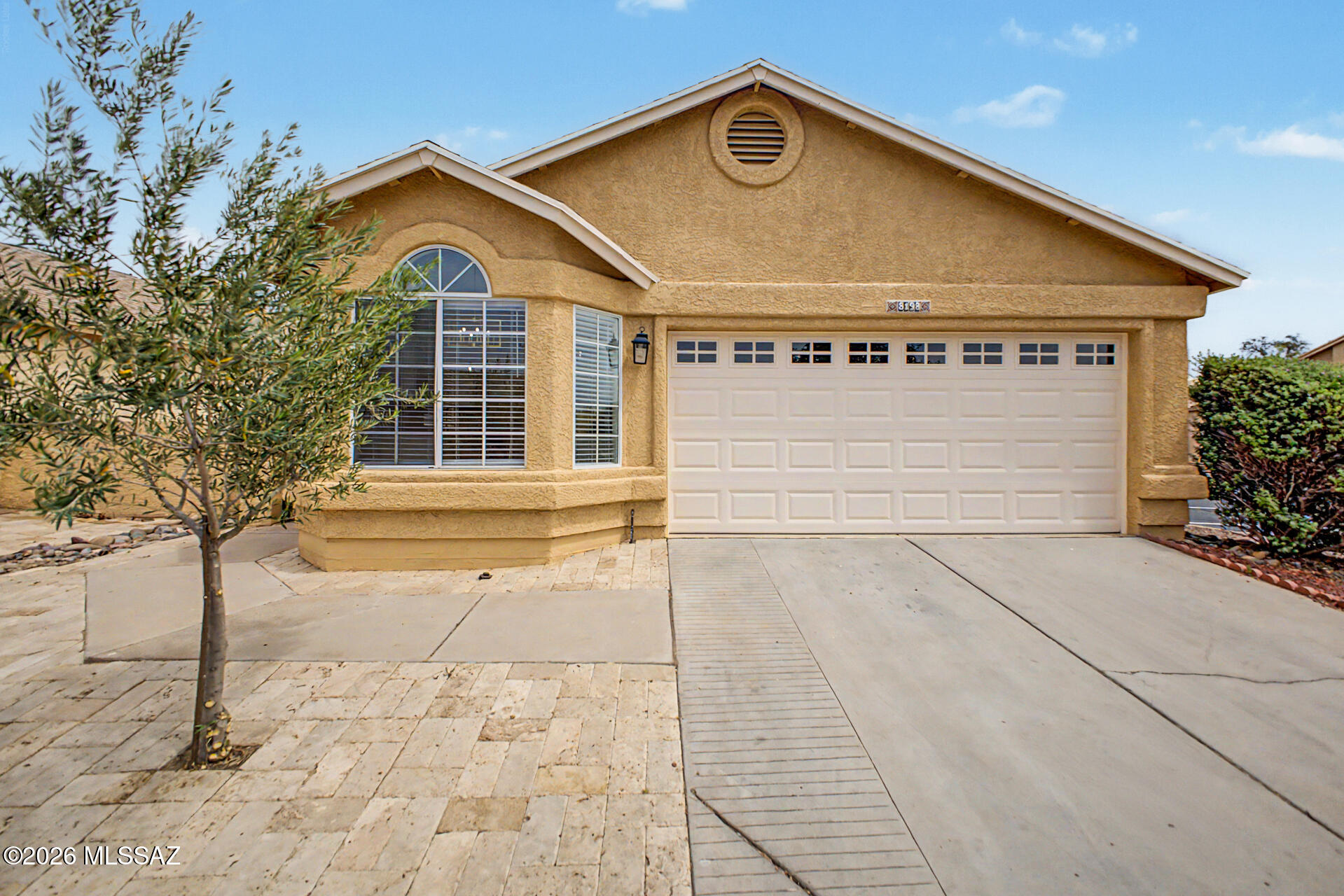 Welcome to Moondance Village, where this TASTEFULLY UPDATED home awaits you! Offering 3 beds, 2 baths, 2-car garage, & a low-care landscape. The inviting interior features a fresh neutral palette, vaulted ceilings, abundant natural light, wood-look tile flooring in common areas, and plush carpet in bedrooms. You'll love the seamlessly flowing living & dining room, perfect for entertaining! The upgraded kitchen boasts SS appliances, quartz counters, white shaker cabinetry, a pantry, and a cozy breakfast nook w/bay window. Large main bedroom has a spotless bathroom with dual sinks & a walk-in closet. Both bathrooms have been updated. One secondary bedroom provides sliding doors that open to the back! With a covered patio, the backyard is the ideal spot to relax or enjoy BBQ. Make this yours!