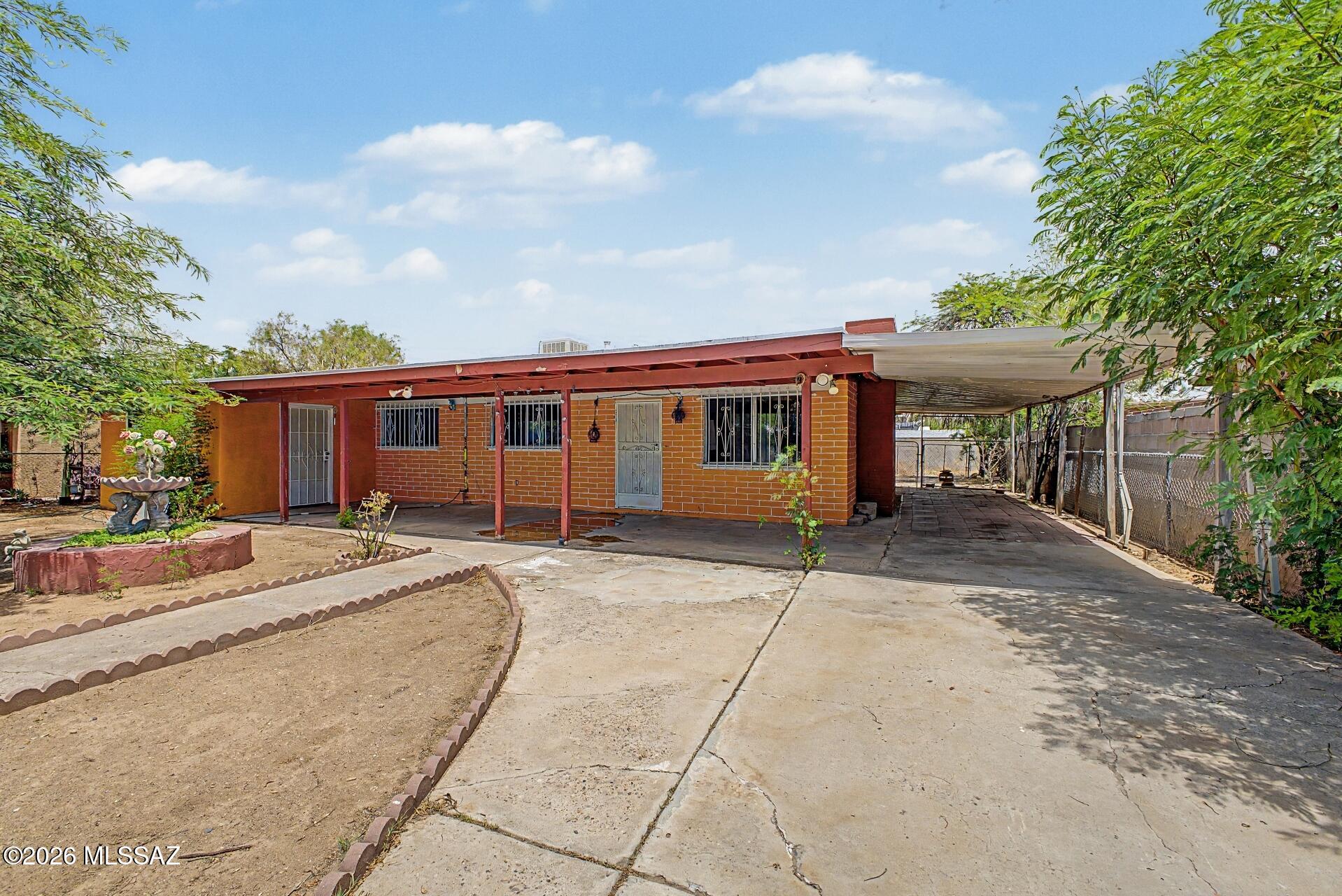 This property is eligible for a first-time homebuyer grant program offering up to $17,500 toward down payment and closing costs. Buyer must qualify for the program. Great opportunity for an owner-occupant, investor, or contractor looking to add value. This Territorial-style home is being sold AS-IS and offers approximately 1,942 sq. ft. of enclosed living space with 4 bedrooms, 2 bathrooms, a spacious living room, dining area, laundry room, den, and multiple bonus rooms. The original home consists of approximately 1,183 sq. ft. as reflected in the original floor plan. The property also includes approximately 759 sq. ft. of unpermitted additions, expanding the home with a large primary bedroom, an additional bedroom, second bathroom, den, laundry room, and bonus rooms, creating a flexible floor plan with abundant living space.
Conveniently located in South Tucson with no HOA, this property offers tremendous potential for renovation, rental income, or customization.