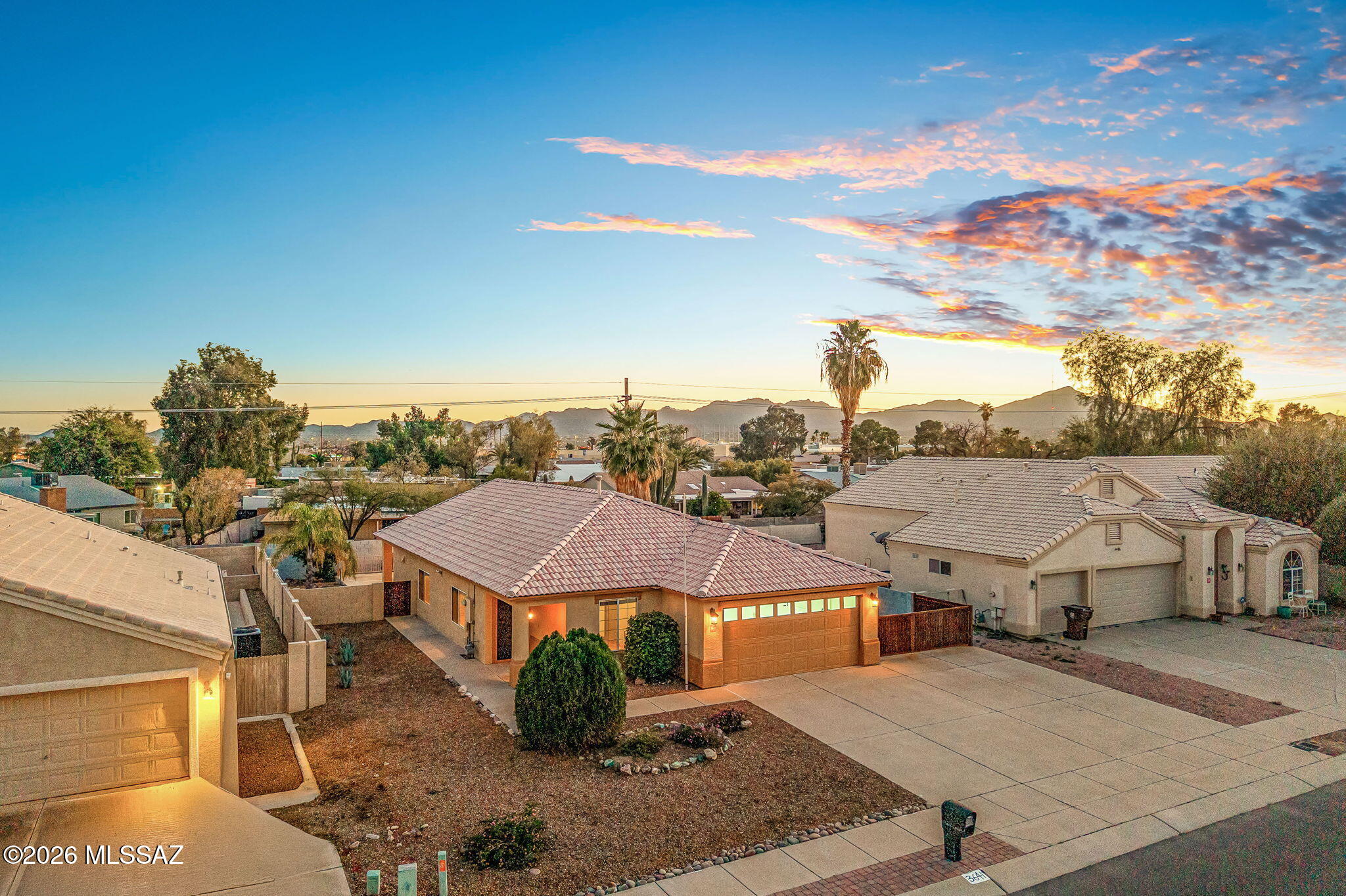 Over $40k in recent updates. NO HOA. All-new appliances, a new 2025 HVAC system, and a new 30-amp RV hookup highlight this custom-built, meticulously maintained 2-bedroom, 2-bath home with flexible bonus space off the living and dining area—ideal for a home office, den, or optional third bedroom.

Cathedral ceilings and travertine-style tumbled porcelain tile run throughout the home (no carpet), including the base, bath, and shower surrounds, creating a bright, cohesive interior. Bathrooms feature coordinating mosaic shower floors and decorative accent borders. The kitchen and baths are finished with Corian countertops, custom Cardell cabinetry, and a reverse-osmosis water purification system at the kitchen sink. Additional features include ceiling fans in every room, security screen doors by Security Screen Masters, and a WiFi-enabled Chamberlain belt-drive garage door opener (myQ). The covered ramada is enhanced with new Allen + Roth outdoor shades, adding comfort and usability year-round. Laundry is front-load ready.

The backyard is designed for both relaxation and functionality, featuring a powered covered ramada, space and electrical for a hot tub, new 2025 irrigation, an 8×16 storage shed, new Corten steel gates, and extra gated space ideal for guest parking, recreational vehicles, or EV charging via the new 30-amp hookup.

Conveniently located near shopping, dining, and everyday amenities. Truly move-in ready with pride of ownership throughoutand no HOA!