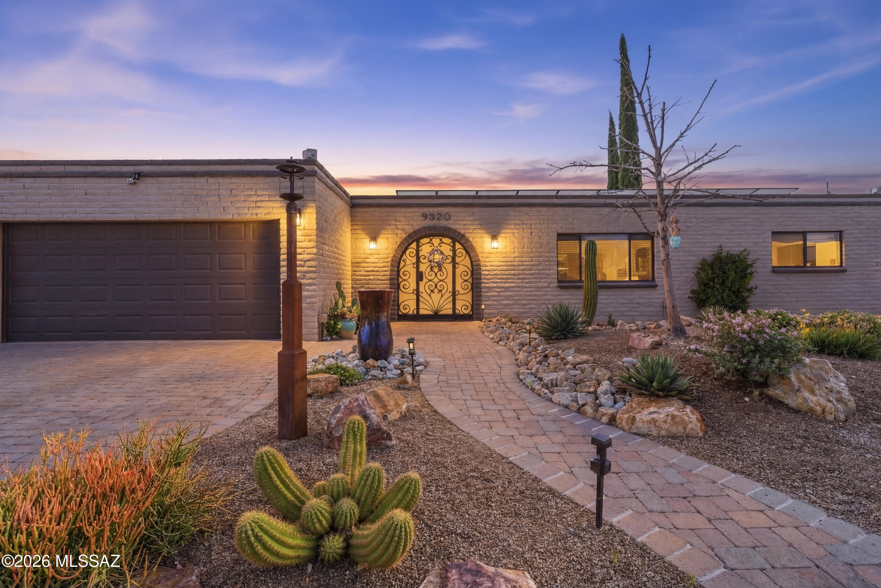 Over $500,000 in improvements and upgrades since 2012! Luxury, energy-efficient, and extensively upgraded, this home features owned solar with Tesla Powerwall, a new roof, new HVAC, and an upgraded electrical panel. The remodeled kitchen offers granite counters, gas cooking, a beverage center, and custom knotty alder details, opening to inviting living spaces with added beams and character. The spacious primary suite includes a spa-style bath with soaking tub and walk-through shower. Outside, enjoy a resort-style backyard with saltwater pool, koi pond, extended patio, and a stunning outdoor kitchen with pizza oven, fireplace, and covered entertaining space--perfect for Arizona living.