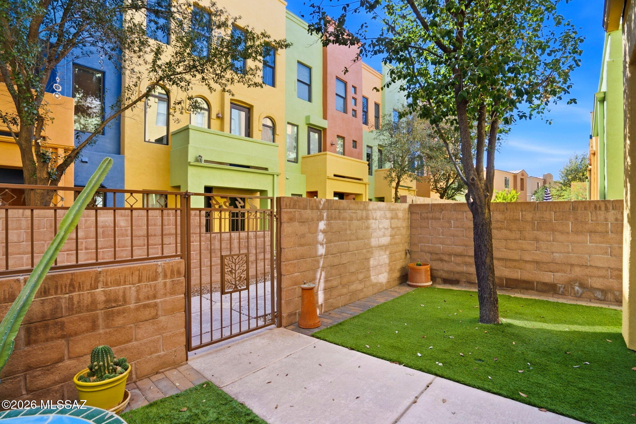 Stunning 3-story townhome in gated River Walk--steps from The Loop & St. Philips Plaza. Modern layout features a private elevator, main-level bedroom, 2nd-floor living & kitchen, 360 mountain and sunset views and dual primary suites on the 3rd floor. The showstopper: a rooftop deck with built-in BBQ, outdoor kitchen & panoramic mountain views--perfect for entertaining or quiet evenings. 3BR/3BA, 2,088 SF, 2-car garage w/ extra storage. Community pool, spa & clubhouse. Walk or bike to restaurants, shopping & Trader Joe's. This is Tucson living at its best!