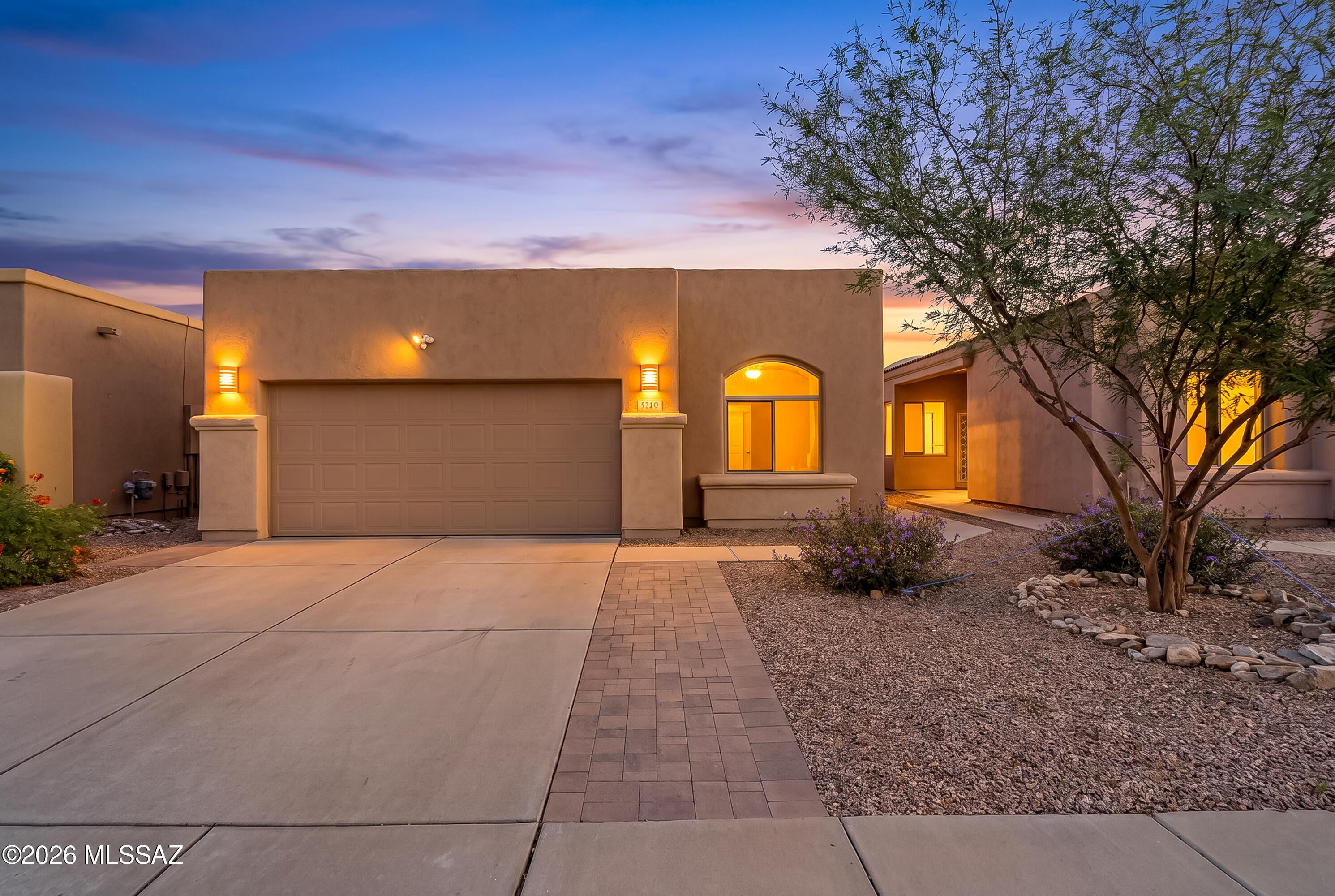 Welcome to your NW Tucson home in the popular Riverside Crossing community!  Inviting AF Sterling 1,483 SF, three-bedroom, two bath designed home offers modern updates and timeless character.  High ceilings, elegant arches, and polished concrete floors create a distinctive style that flows throughout. The well-appointed kitchen features crisp white cabinetry, GE stainless steel appliances, a subway tile backsplash, cabinet pantry, and breakfast bar. A charming breakfast nook surrounded by windows is the perfect place to enjoy your morning coffee.  The spacious great room opens through sliding glass doors to a backyard designed for relaxing and entertaining. Enjoy brick pavers, lush low maintenance turf, mature landscaping, and a hot tub that invites you to unwind under the Arizona skies. Whether hosting friends or enjoying a quiet evening at home, this outdoor retreat offers the perfect blend of comfort and easy living.
The primary suite features two closets and a beautifully updated, spa inspired walk in shower with elegant tile, decorative mosaic accents, a built in niche, and sleek glass enclosure. The guest bathroom continues the modern feel with a rich charcoal vanity, crisp white countertop, and stylish tilework finished with a striking dark mosaic accent.

HOA amenities include community pool, front yard maintenance, trash collection and street maintenance.  Excellent location close to restaurants, parks, river path and medical centers. 
Combining distinctive architectural details, stylish updates, and a low maintenance backyard retreat, this home offers comfort, character, and everyday convenience. Ideally located near shopping, restaurants, hospitals, and with easy access to I 10, this is a home you won't want to miss!