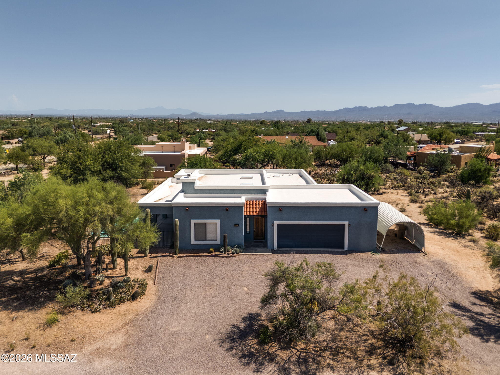 Priced from $600,000-$625,000, this custom 4-bedroom, 2-bath home sits on a lush 1-acre desert oasis with stunning mountain views. The open great room concept features soaring ceilings, a cozy fireplace, and a wall of windows that flood the home with natural light while overlooking the sparkling pool and desert landscape. The split floor plan offers privacy, and the spacious primary suite includes a soaking tub and walk-in closet. Enjoy Arizona living on the expansive covered patio, perfect for outdoor dining and entertaining. The oversized garage includes a workshop for hobbies or storage. With no HOA, there's plenty of room for your RV, boat, and toys. Bring your personal touches and make this exceptional property your own!