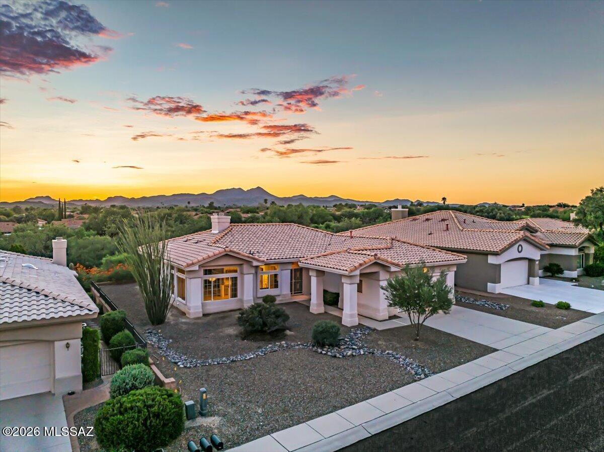 THE BEST DEAL IN SUN CITY is bright and open with Catalina Mountain views from inside the house, plus desert open space (and the golf course...) in back.  This very private home has a newer HVAC, beautiful granite and gas fireplace in the great room. Giant primary suite with double doors, double vanity and spacious walk-in closet. Ready to move-into today, but if you're looking for a spectacular deal on a home that you can update to make your own, this is it.