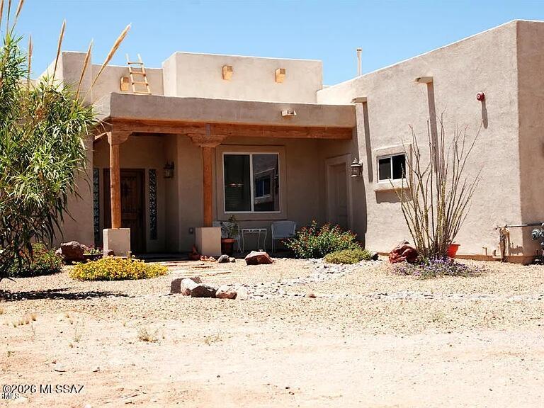 Welcome to this charming 4-bedroom, 2-bath home in Marana, set on 0.826 acres with 1,857 sq. ft. of open living space. Soaring 12-ft ceilings with wood beams highlight the great room, kitchen, and dining area, creating a bright and welcoming feel. Built with 2x6 construction for added insulation, plus a fire suppression system with alarm for peace of mind. The AC is approx. 5 years old and the roof was recoated about 3 years ago. Fully fenced and horse-friendly, with SH zoning allowing up to two homes per acre. A concrete pad is ready for a future workshop. Enjoy stunning mountain and sunset views with state land across the street.
