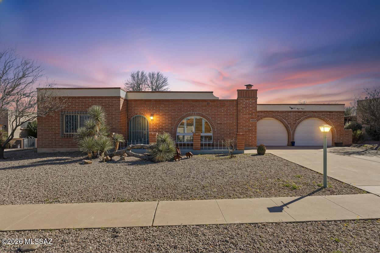 Where Old World Charm Meets Arizona Living
Some homes have character. This one has soul.
From the moment you step inside, the arched windows, warm living room, and timeless details tell a story written in brick, greenery, and golden light -- built for a life well-lived.
The heart of the home flows naturally to the kitchen/dining area and the beloved Arizona room -- sun-drenched in January, intimate on a cool desert evening, and designed for late-night conversations, spirited game nights, and celebrations. It's the room you'll live in year-round.
Step outside and discover the true magic. A screened patio opens to a beautifully bricked outdoor patio beneath a canopy of mature trees -- two spaces that together create a private sanctuary for elegant dinners under the stars or a quiet momen as the desert evening settles in.
Minutes from golf, dining, and Green Valley's vibrant social scene -- you may never want to leave.